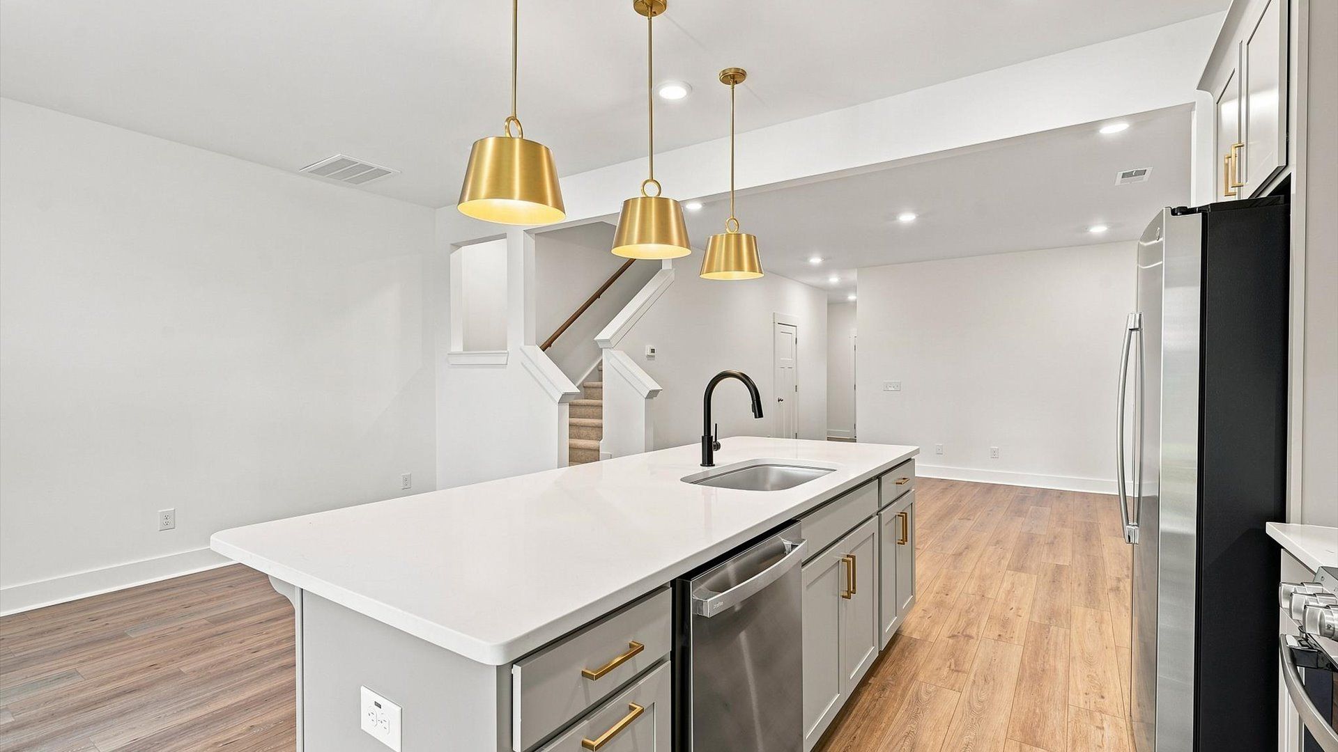 Elegant kitchen featuring a center island with pendant lighting and tasteful finishes throughout in Spartanburg, SC