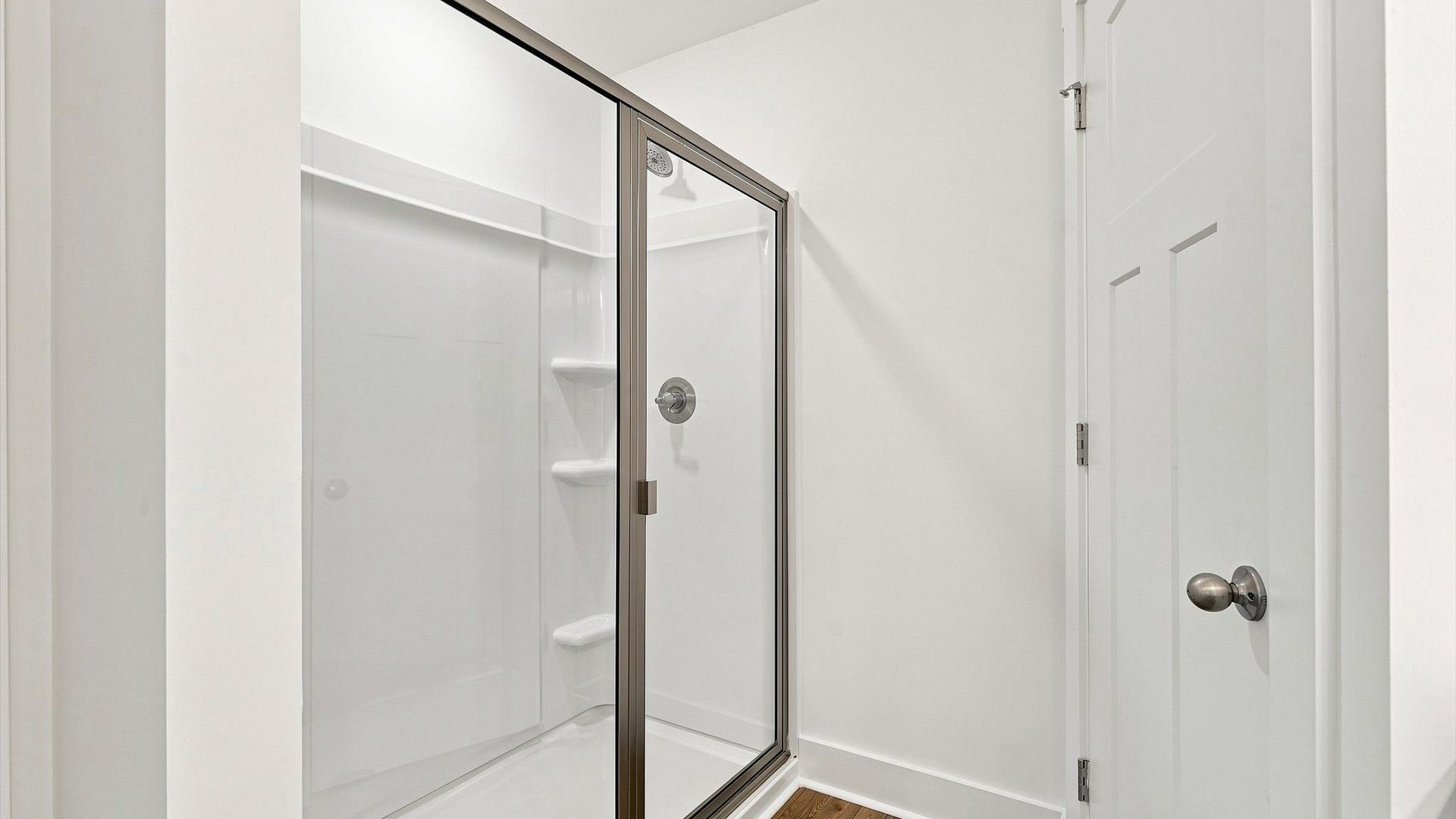 Memorable mornings begin in this elegant primary bathroom with a walk-in shower near Downtown Spartanburg