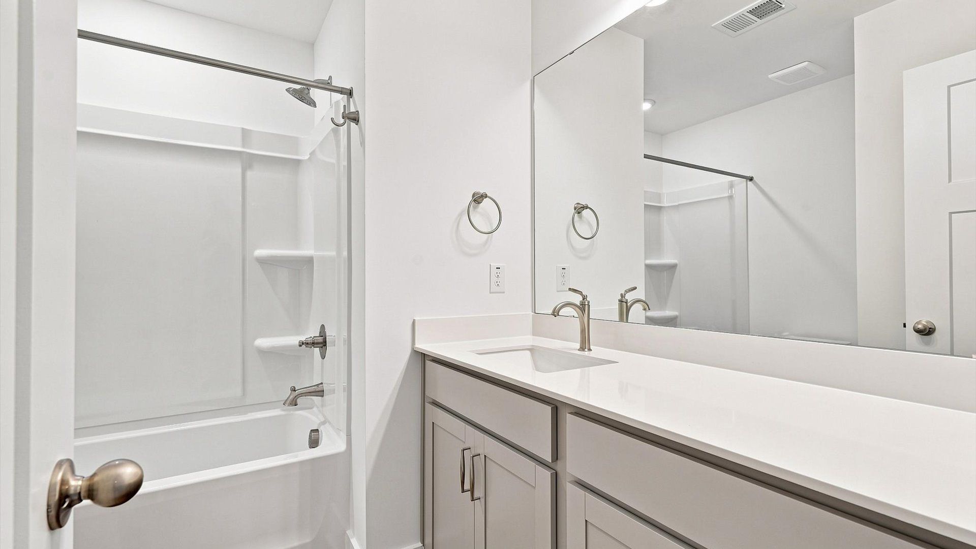 Top-notch bathroom with current fixtures, tasteful materials, and elevated charm at the Ransdell Pointe community
