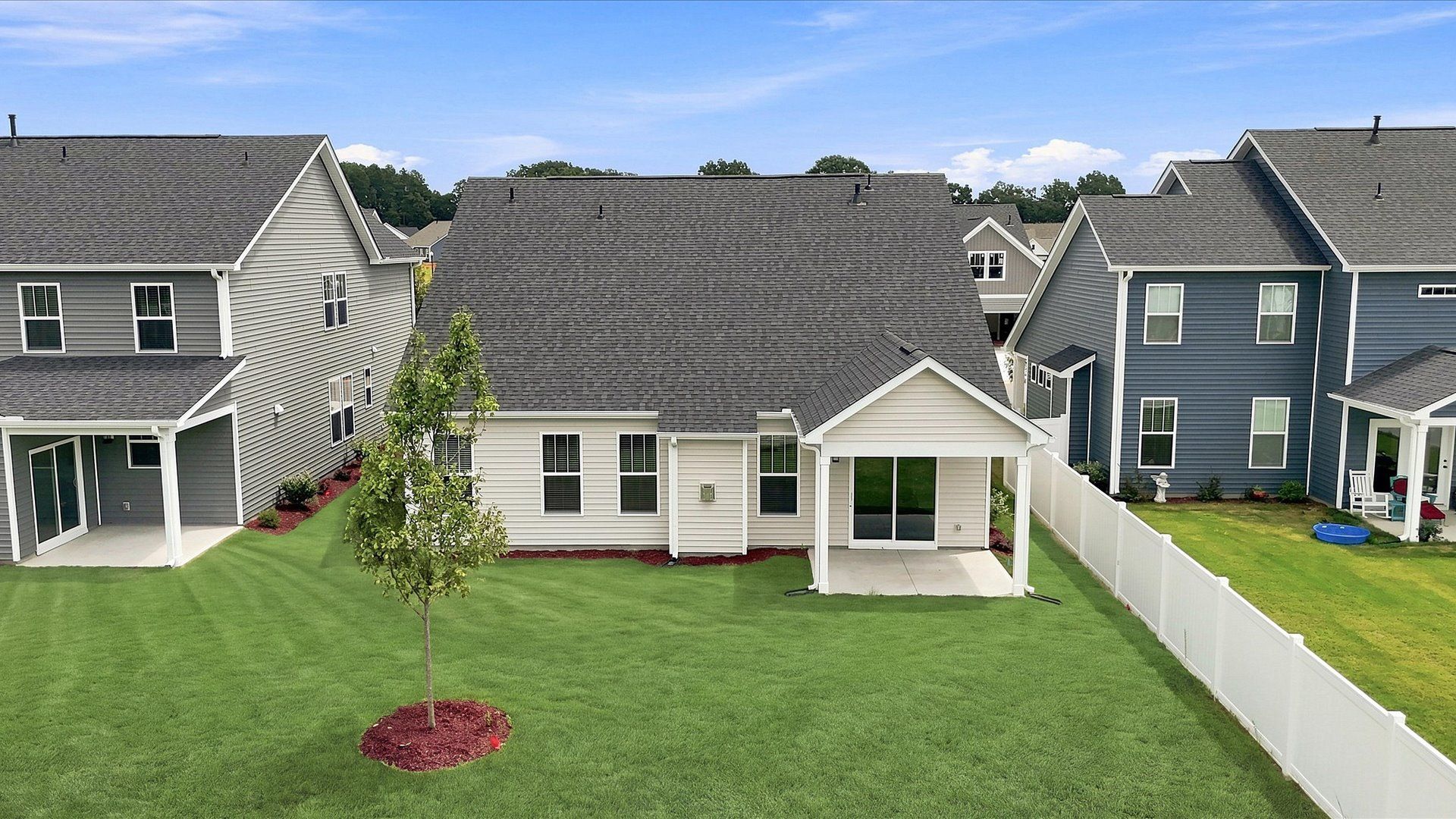 Warm and inviting outdoor living space with a covered rear porch and tasteful finishes at Walnut Ridge