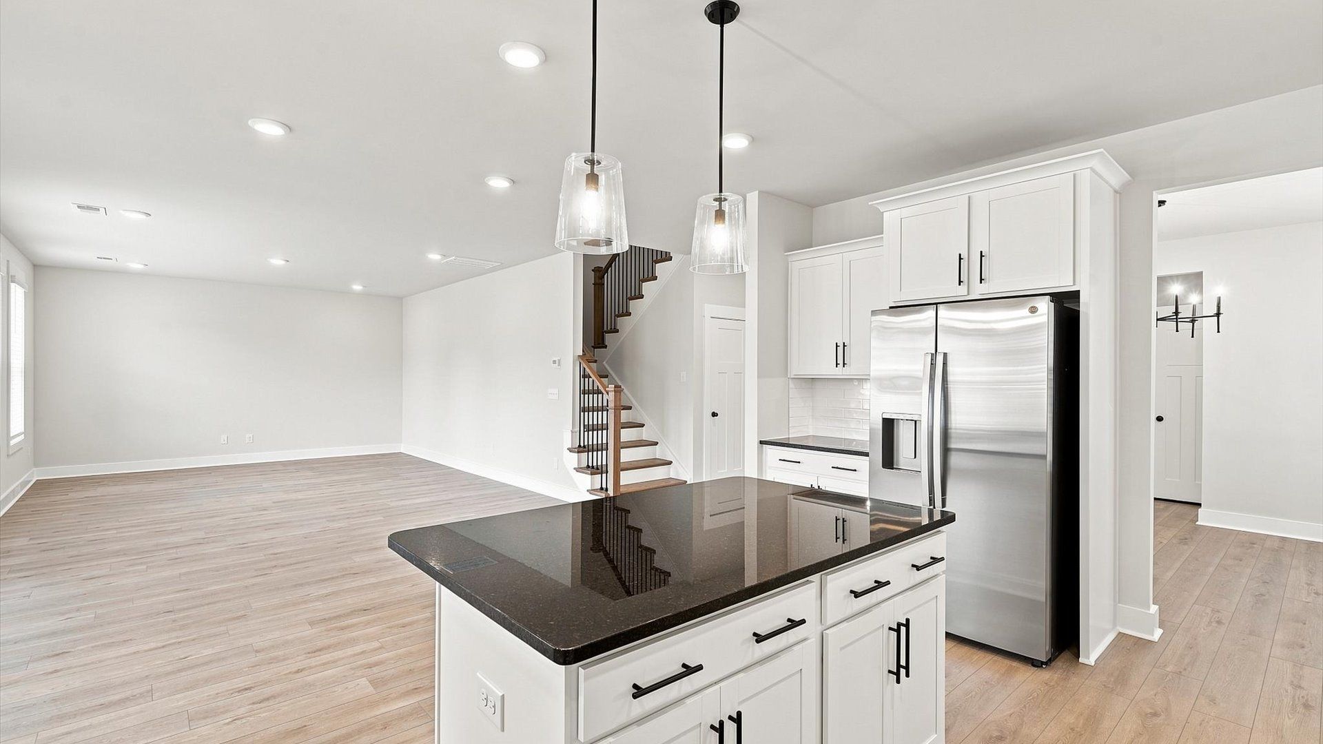 Exceptional culinary space with a center island and eye-catching pendant lights at Walnut Ridge