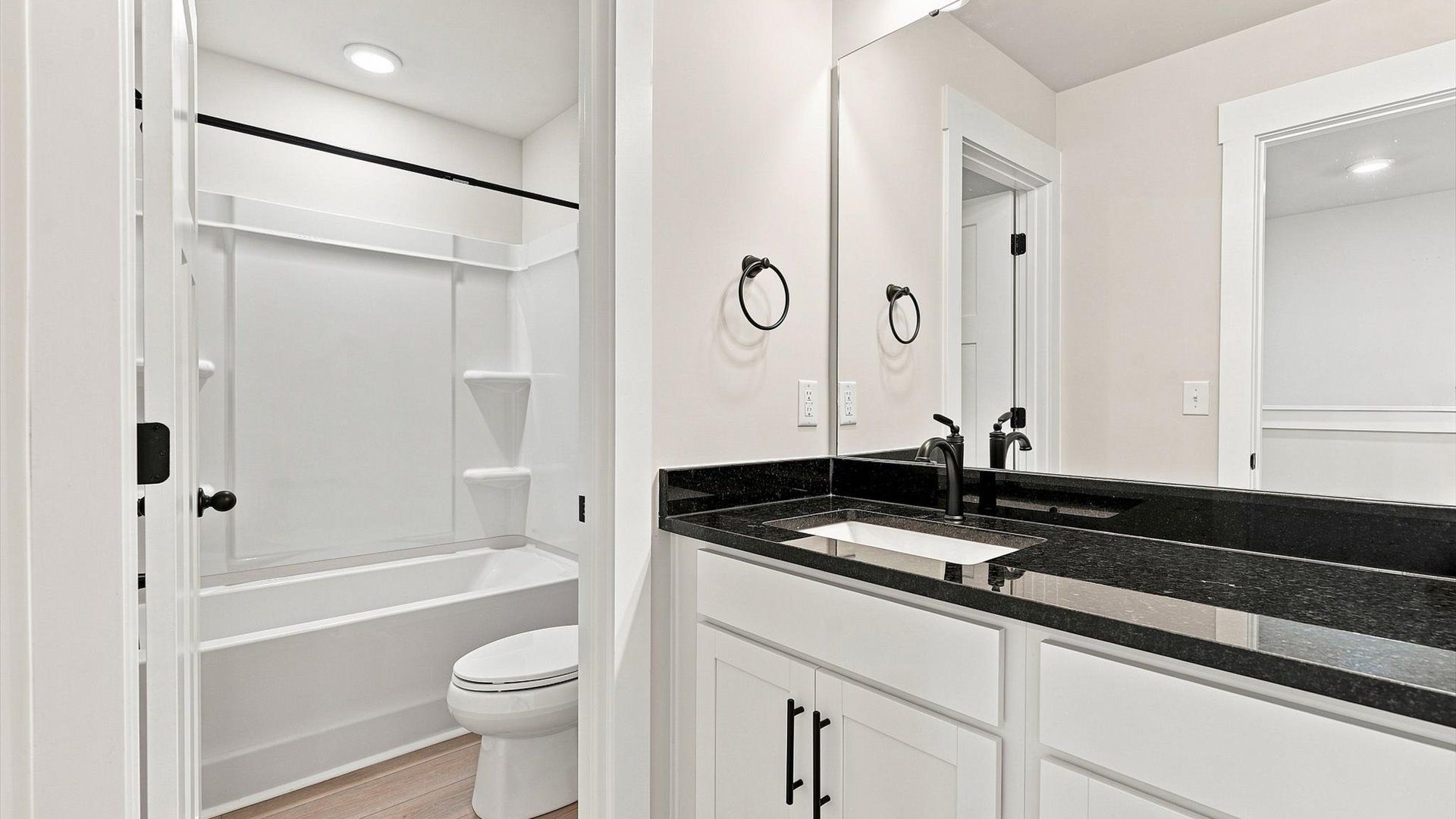 Accomplished bathroom design with sleek tile, high-quality cabinetry, and refined hardware