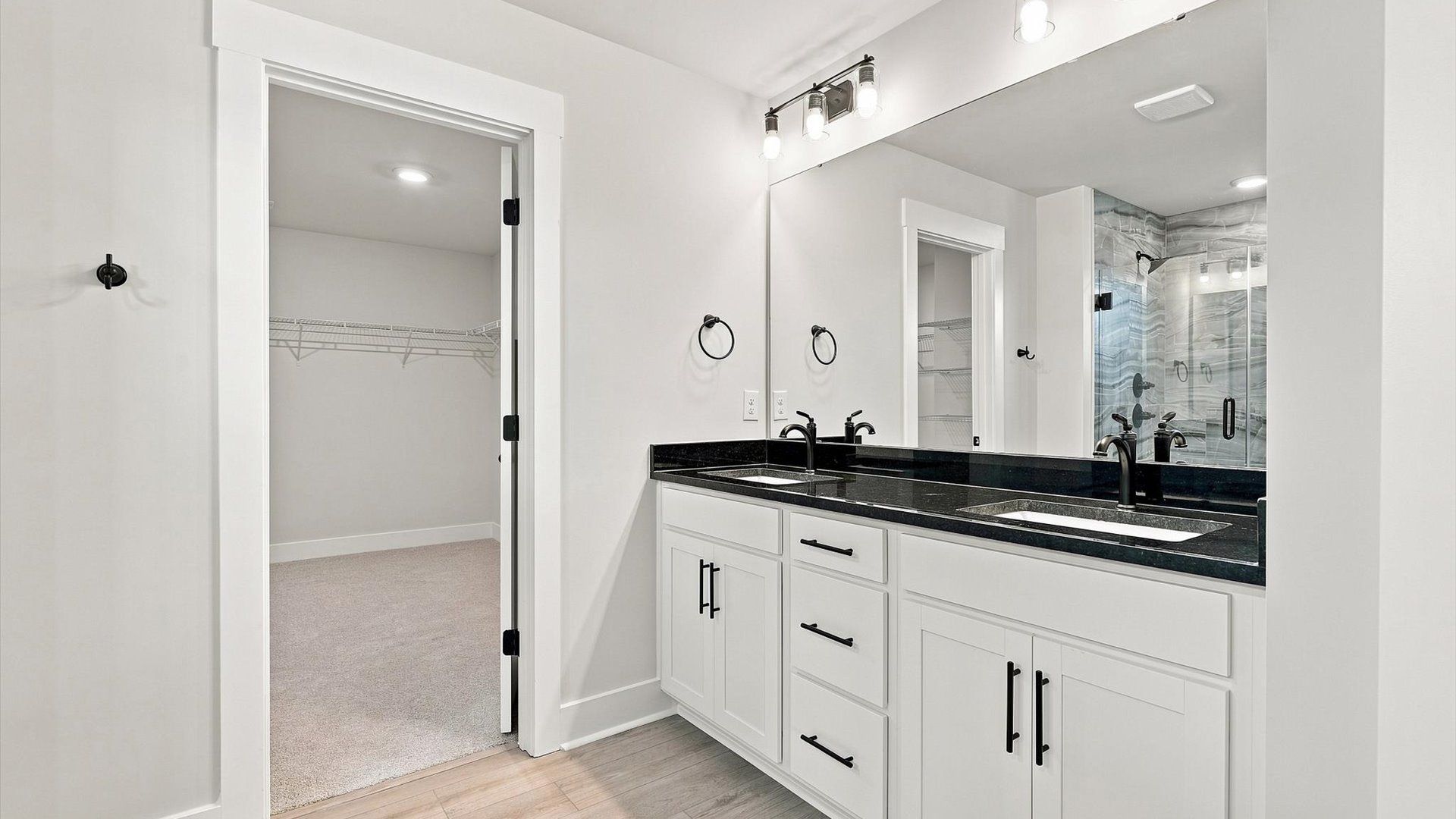 Tasteful primary bath with modern finishes, a walk-in shower, and thoughtful double vanity layout in Inman, SC