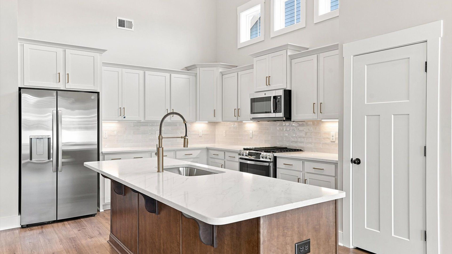 Notable kitchen space with high ceilings and a large island perfect for entertaining located in Inman, SC