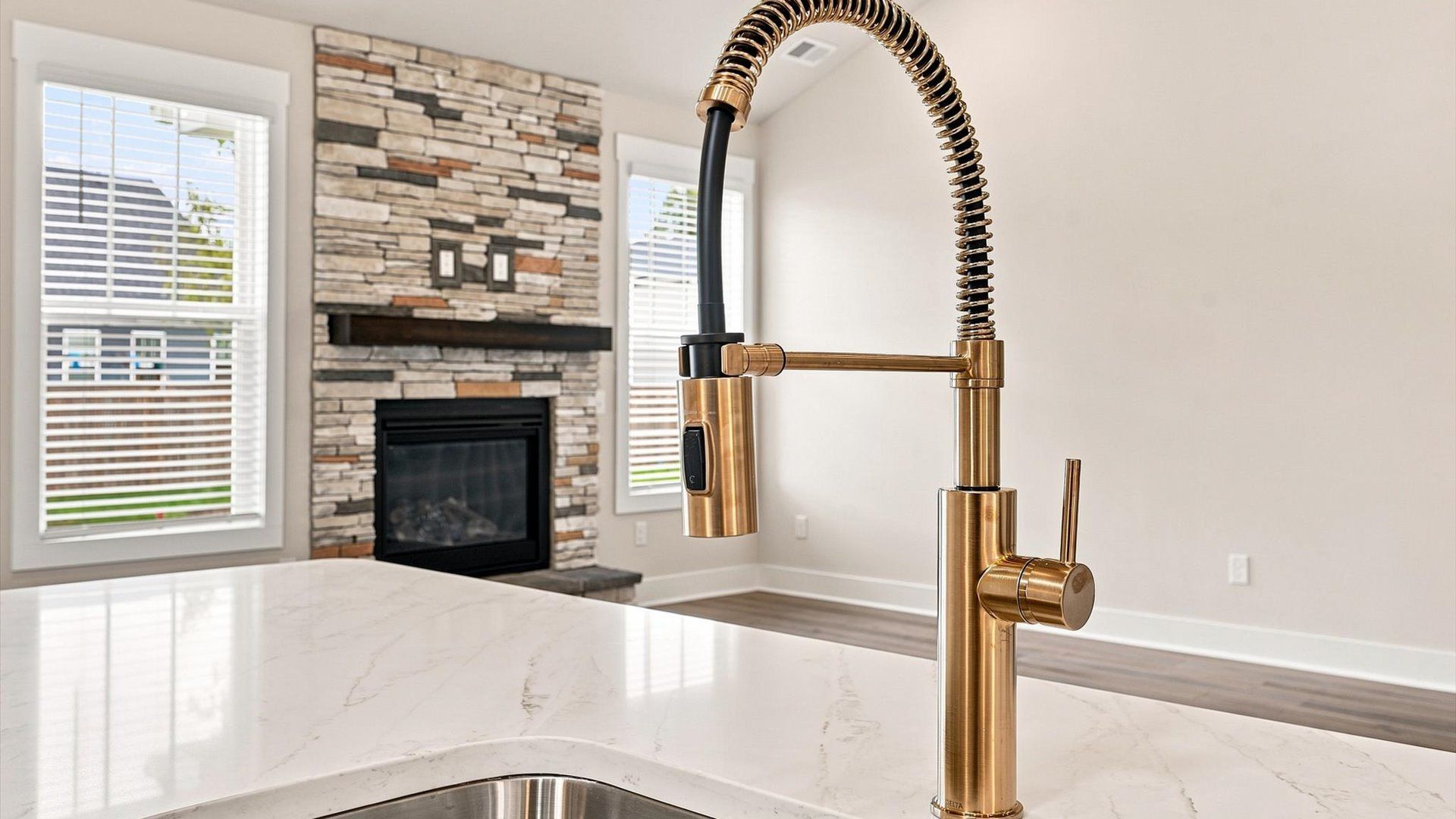 Stunning kitchen centerpiece designed to elevate both entertaining and everyday living by DRB Homes