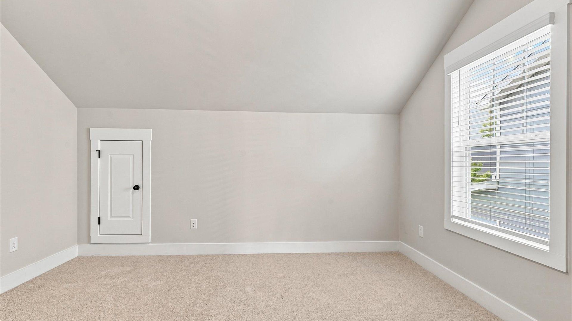 First-rate bedroom with plush carpeting and a large window that provide an open, airy feel at Walnut Ridge