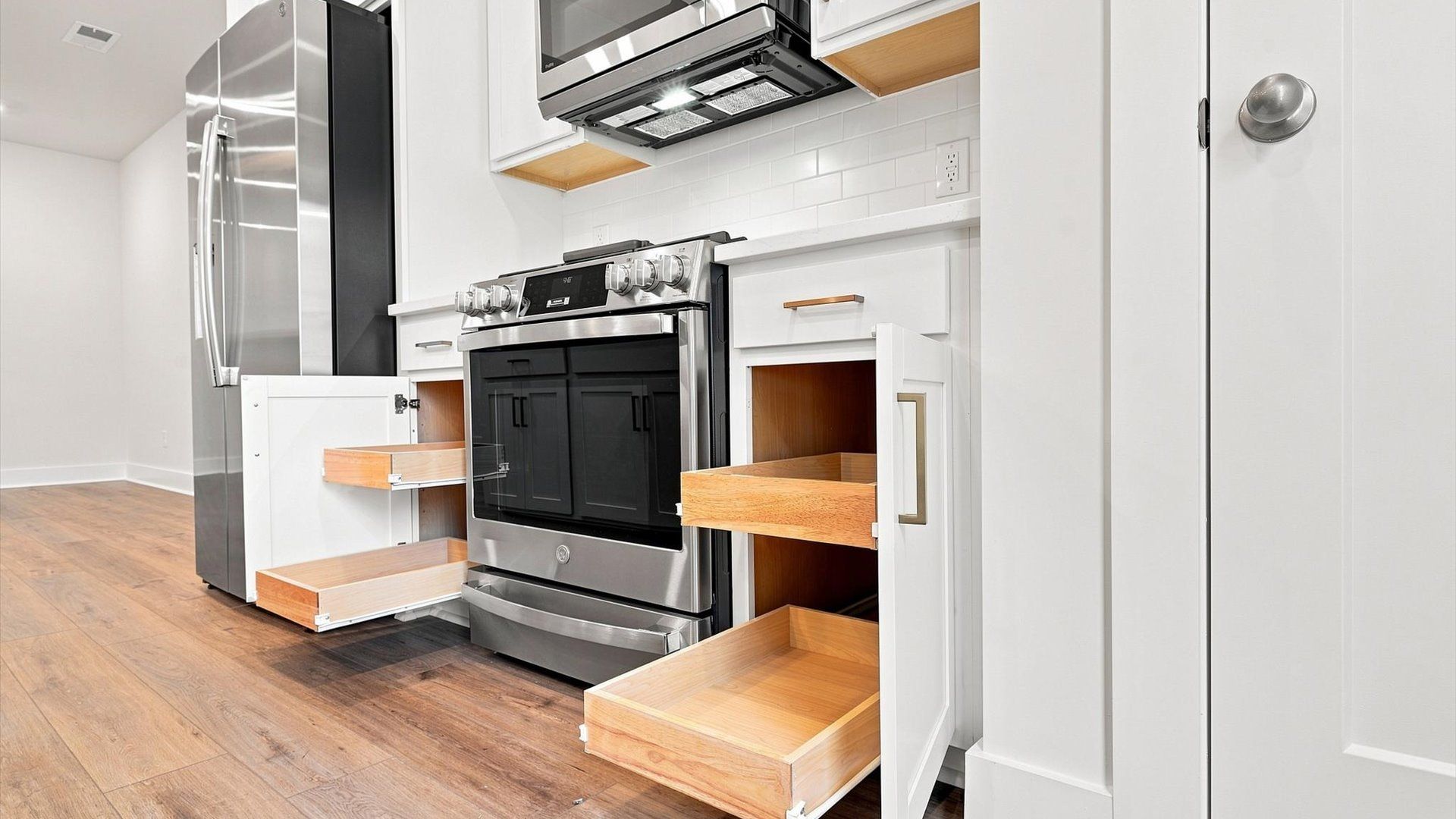 Exceptional kitchen featuring sleek cabinetry, ample storage, and modern finishes by DRB Homes