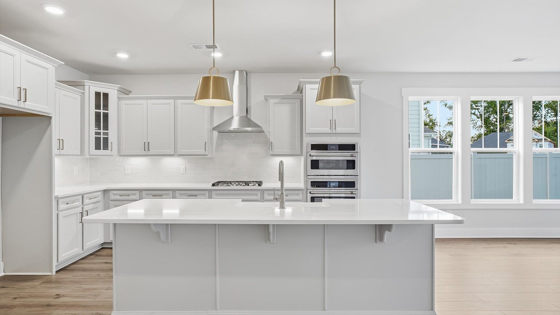 Beautifully appointed kitchen with spacious counters and sophisticated detailing at Creeks at Midway