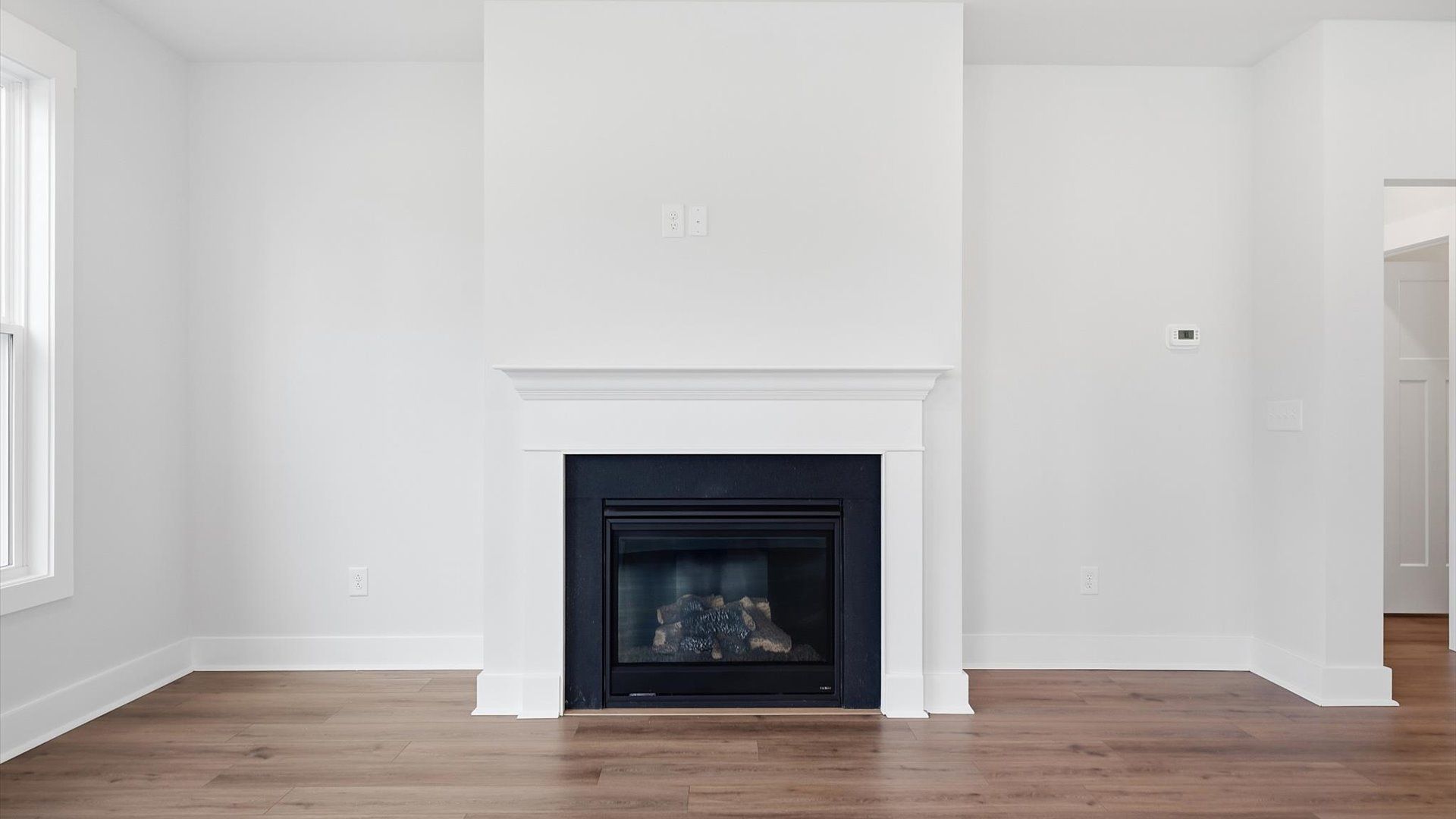 Memorable moments begin in this elegant, open family room with hardwood flooring and refined finishes in Anderson, SC