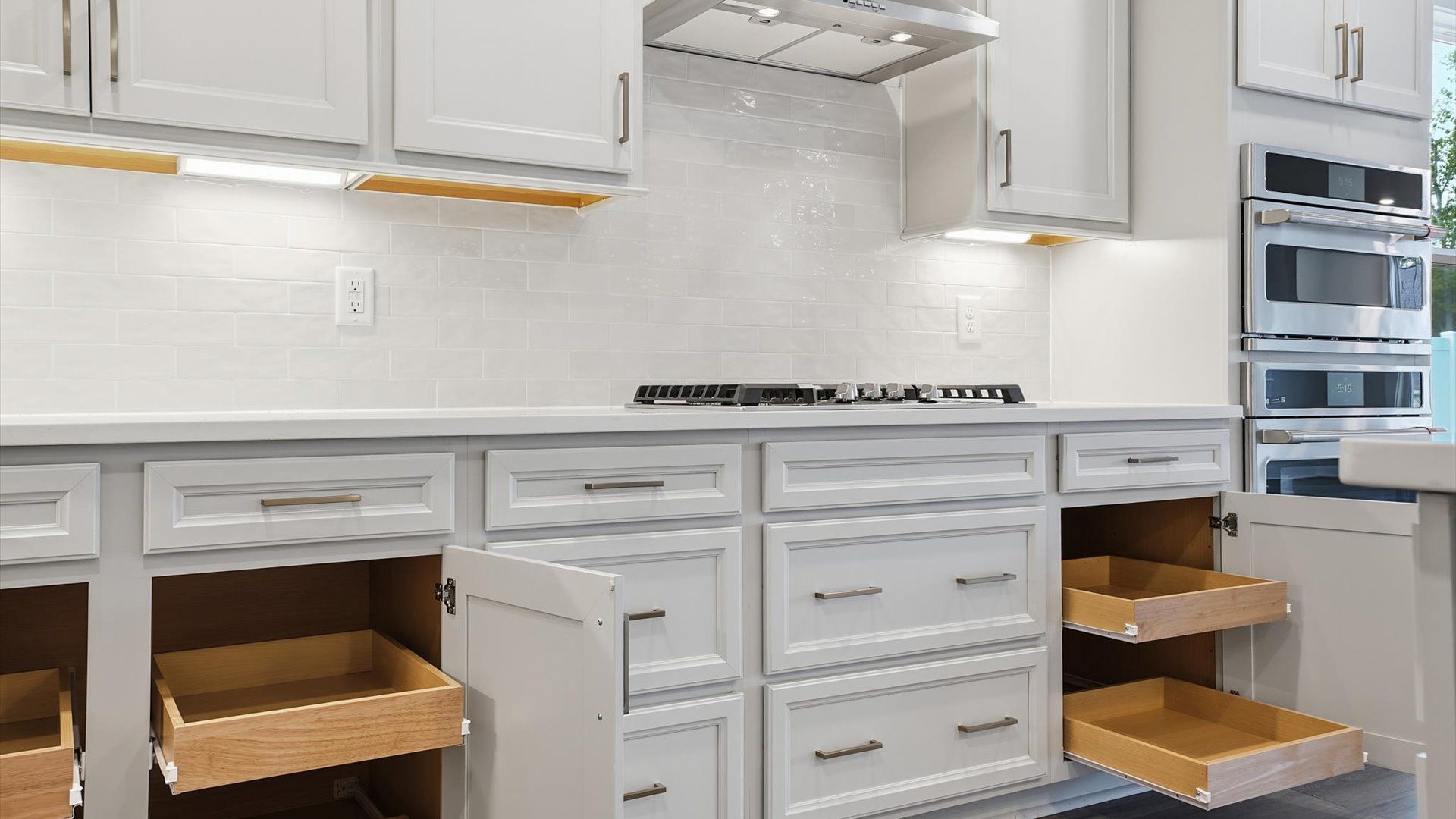First-rate kitchen with functional layout, stainless steel appliances, and abundant storage by DRB Homes