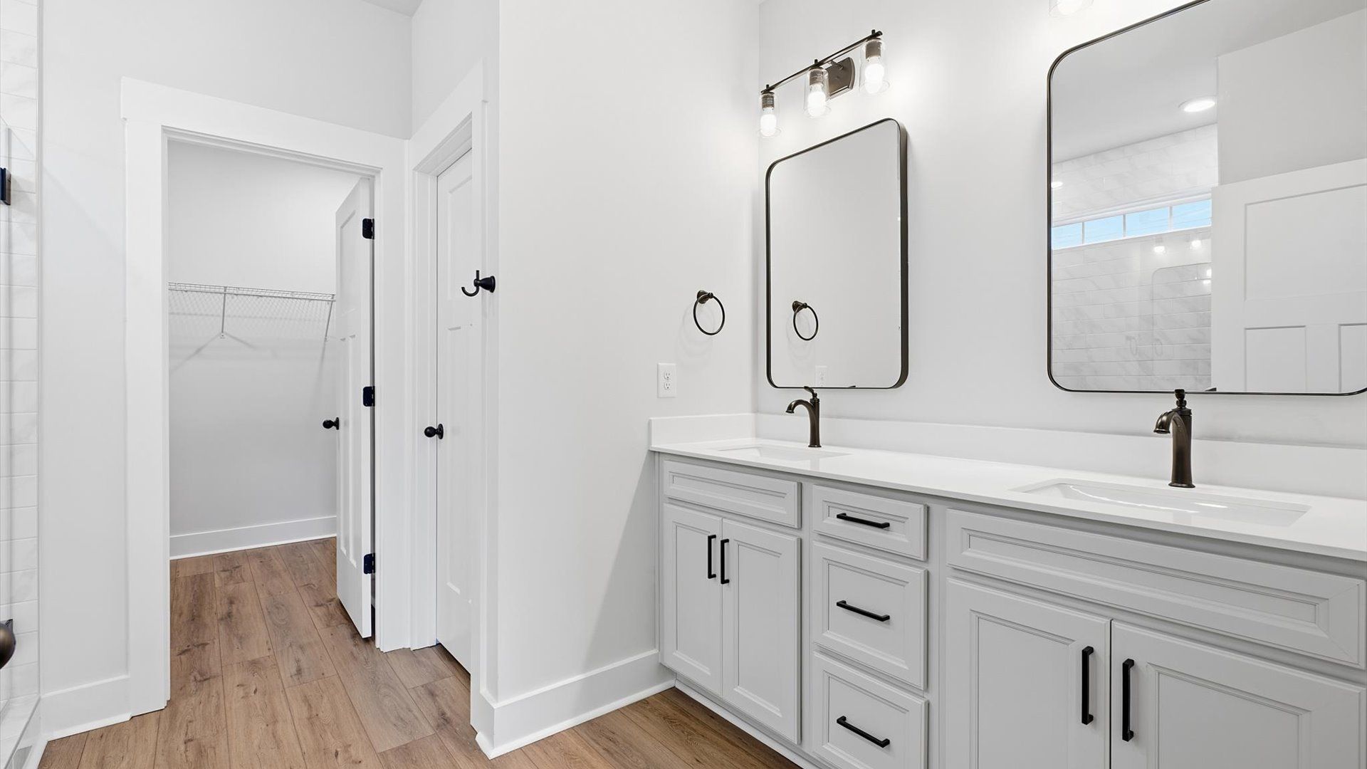 Notable primary suite with dual vanities and walk-in shower in this prime Anderson home