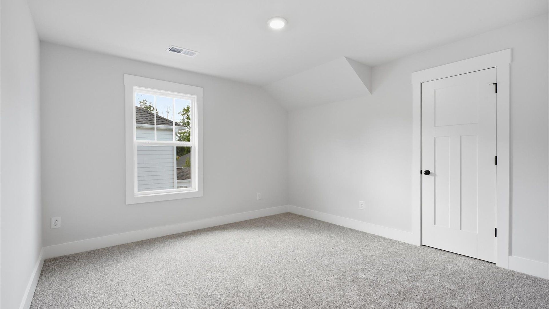 First-class secondary bedroom with comfortable carpeted flooring and generous closet space at Creeks at Midway