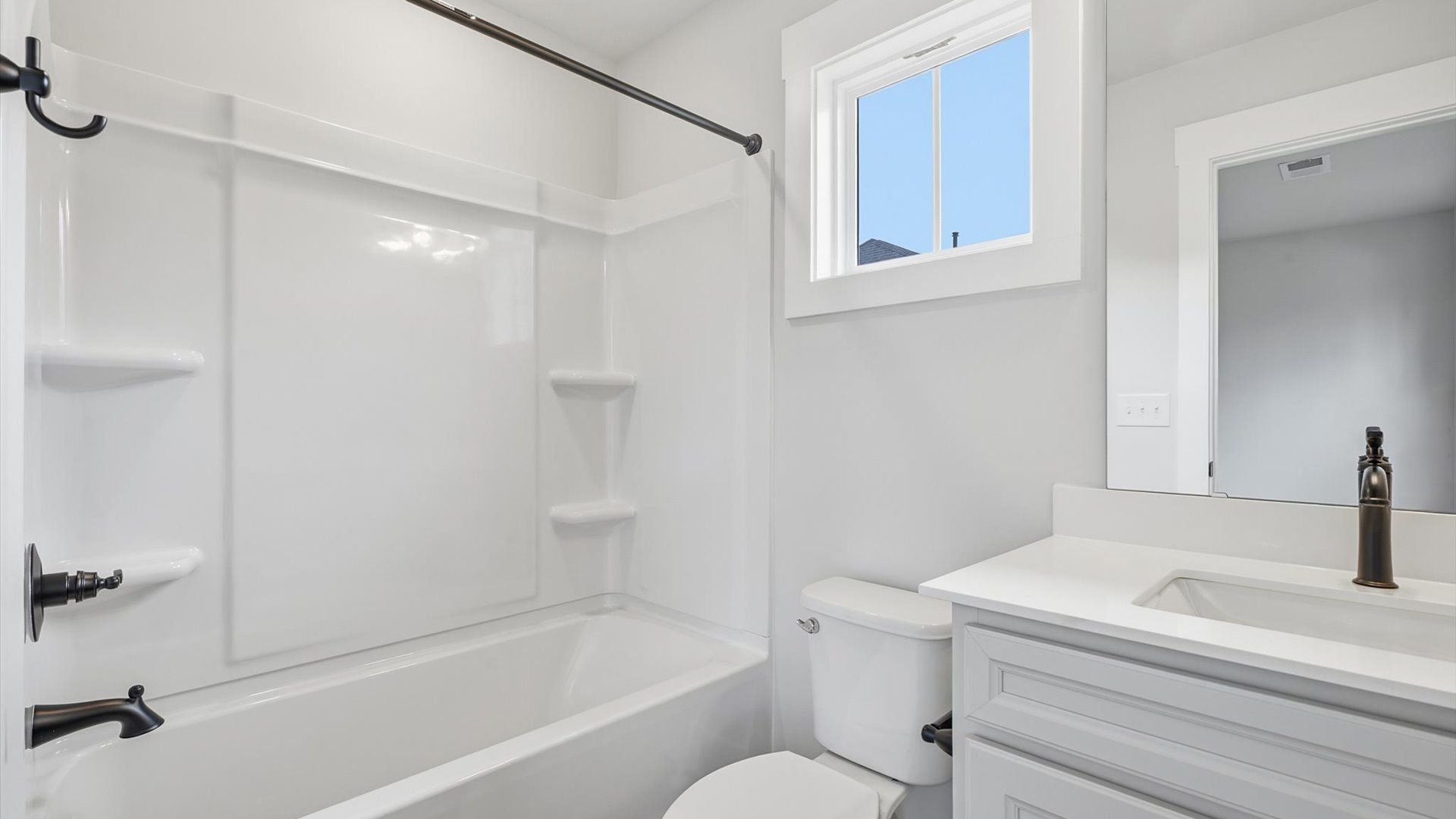 Vibrant and welcoming bathroom with elegant countertop space and polished details