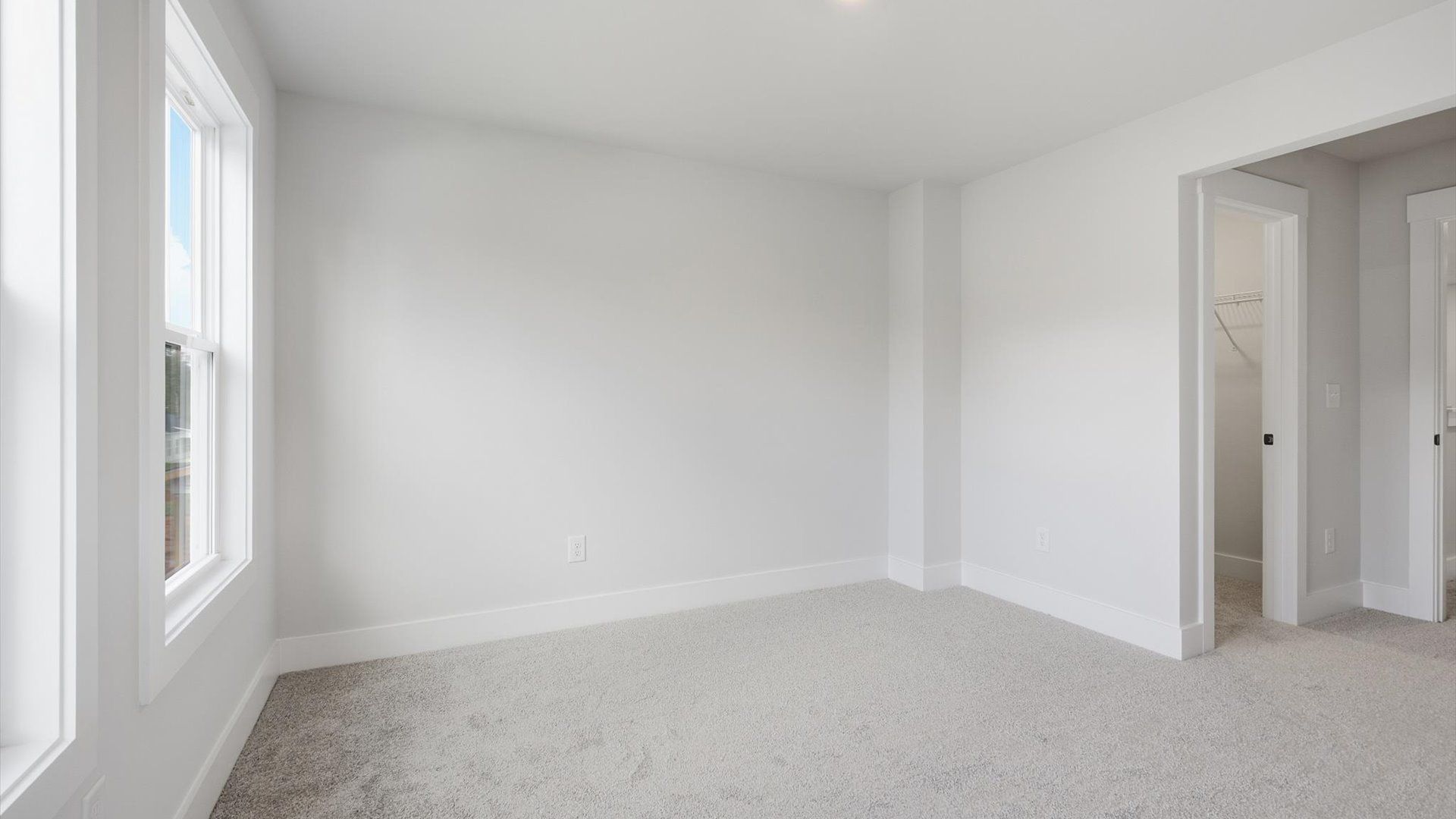 Superior comfort in a secondary bedroom with plush carpet and an oversized walk-in closet near Lake Hartwell