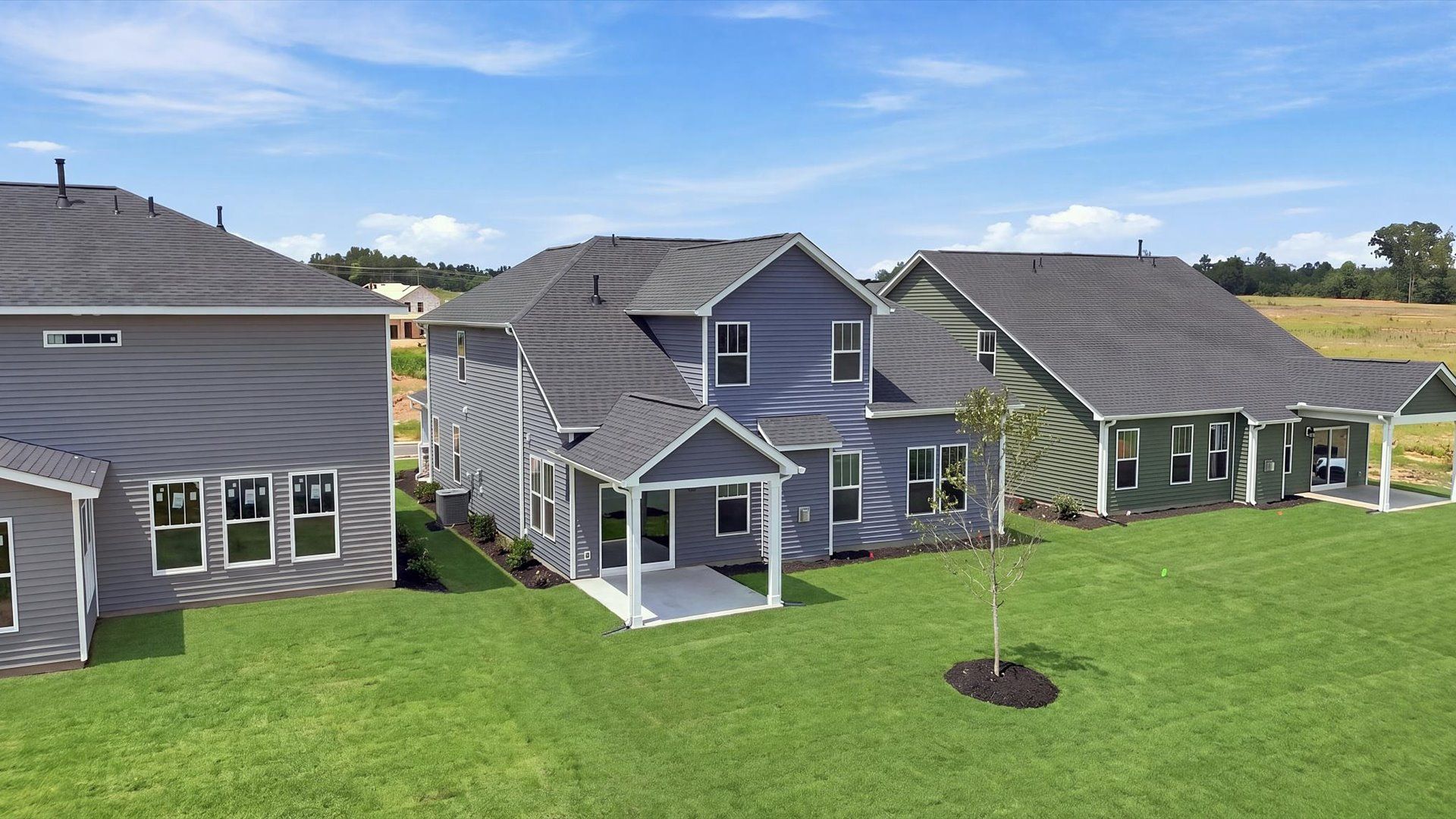 Established charm meets functional outdoor living with a spacious rear covered porch at the Harrier Point community