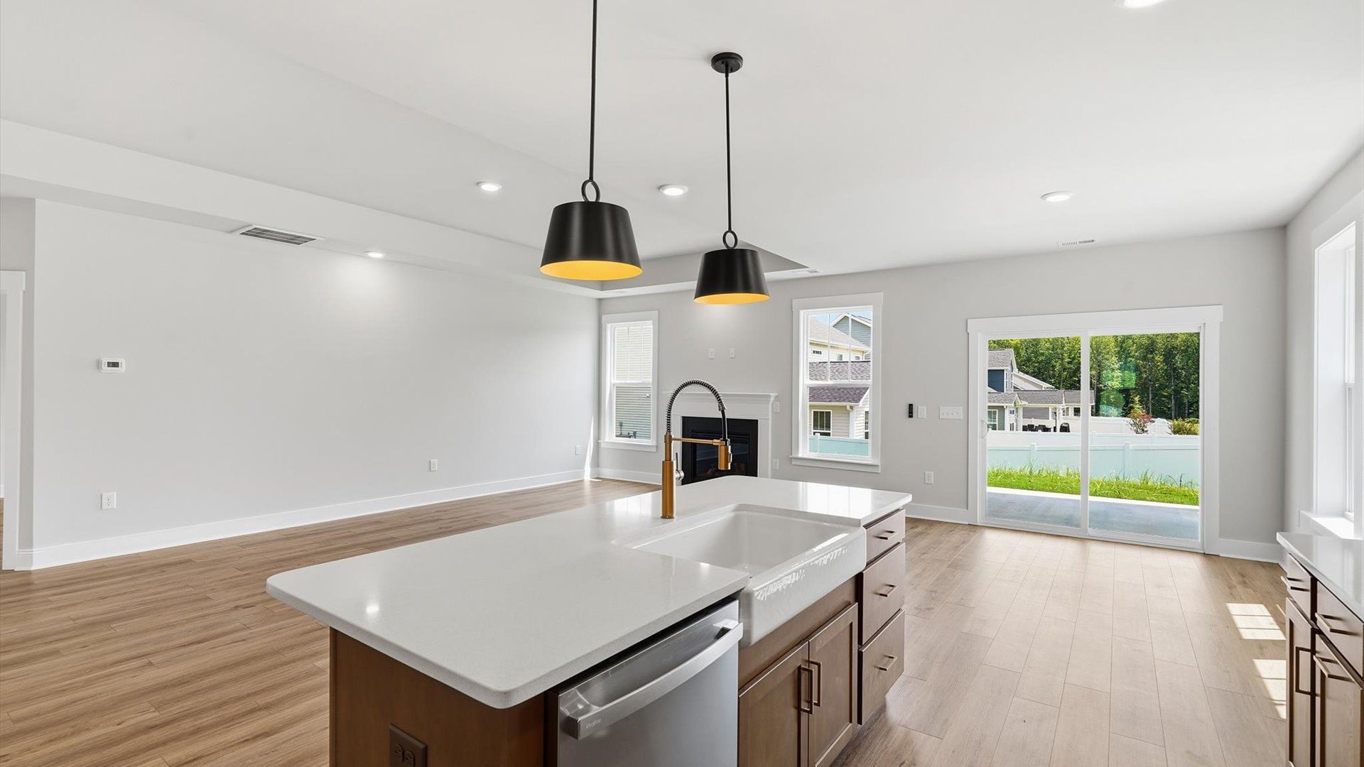 Memorable meals begin in this vibrant kitchen with pendant lighting and a thoughtfully designed island