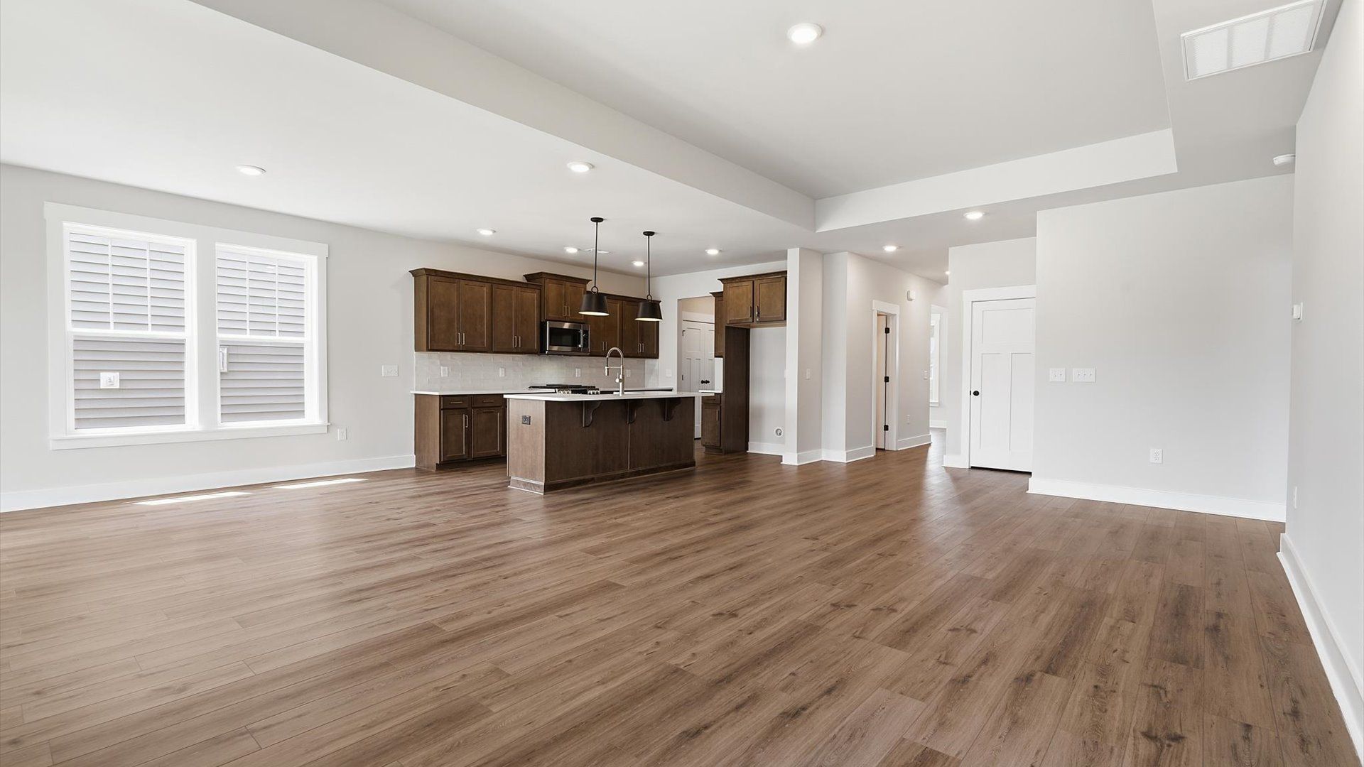First-rate family room with thoughtful layout and superior connection to kitchen and dining spaces in Woodruff, SC