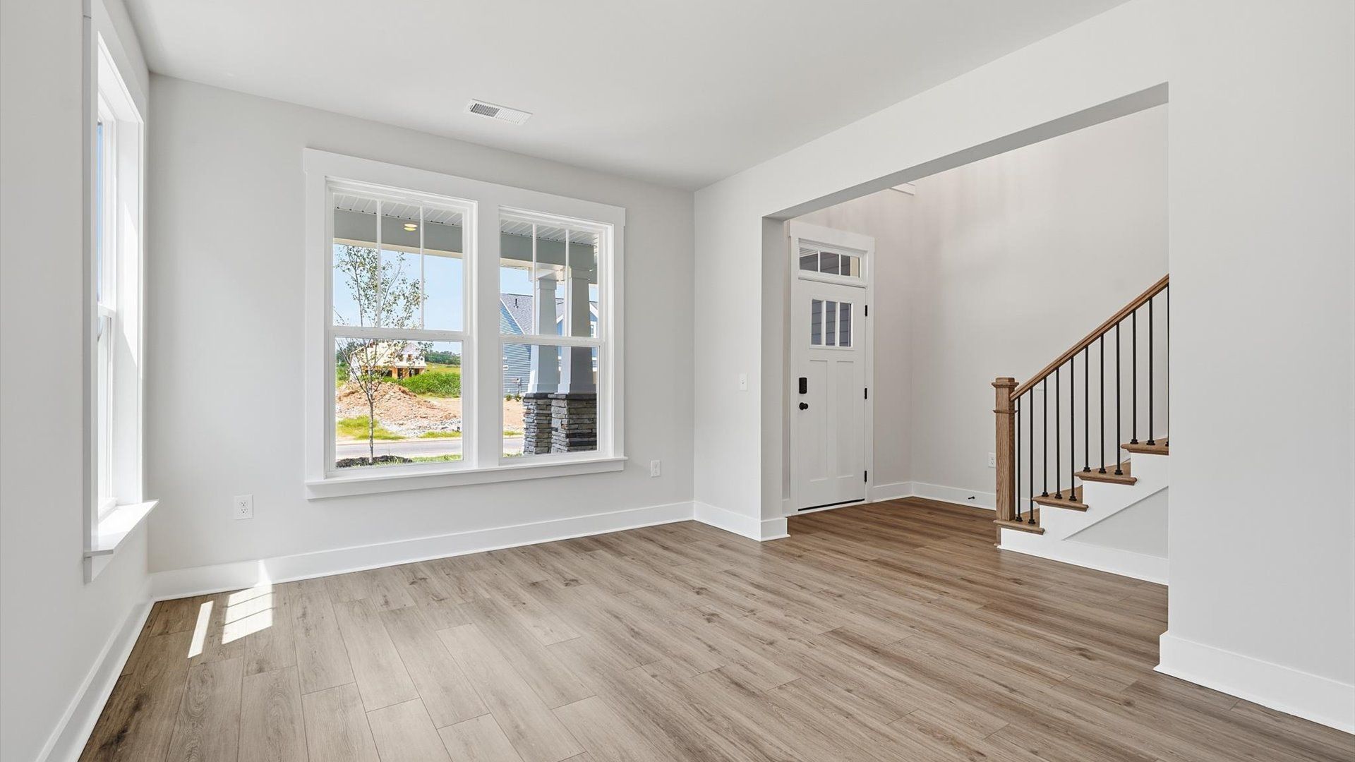 Elegant dining room opens to a functional floor plan with tasteful upgrades throughout at the Harrier Point community