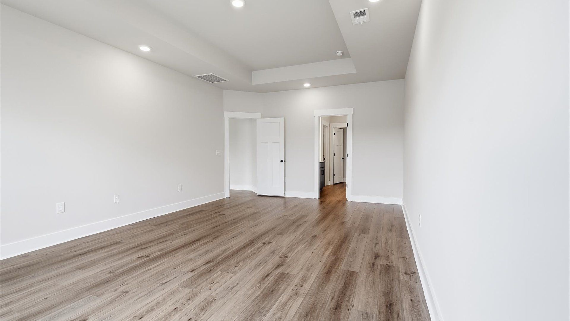 Distinguished primary bedroom featuring upscale finishes and timeless sophistication