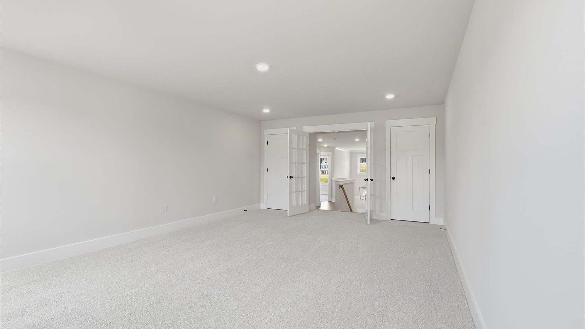 Superior bonus space with soft carpet, ideal for work, relaxation, or entertainment by DRB Homes