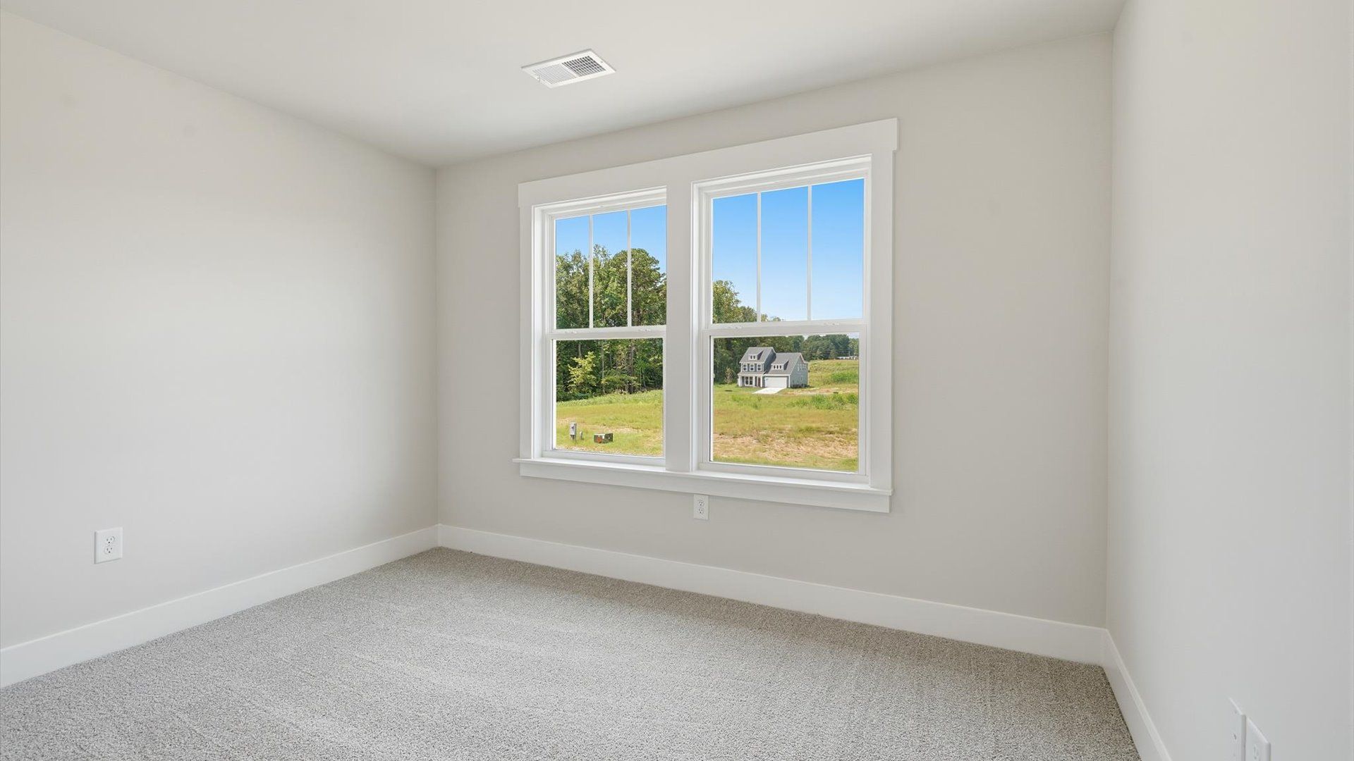 Refined bedroom design with large windows for daylight-filled mornings and peaceful views at Harrier Point