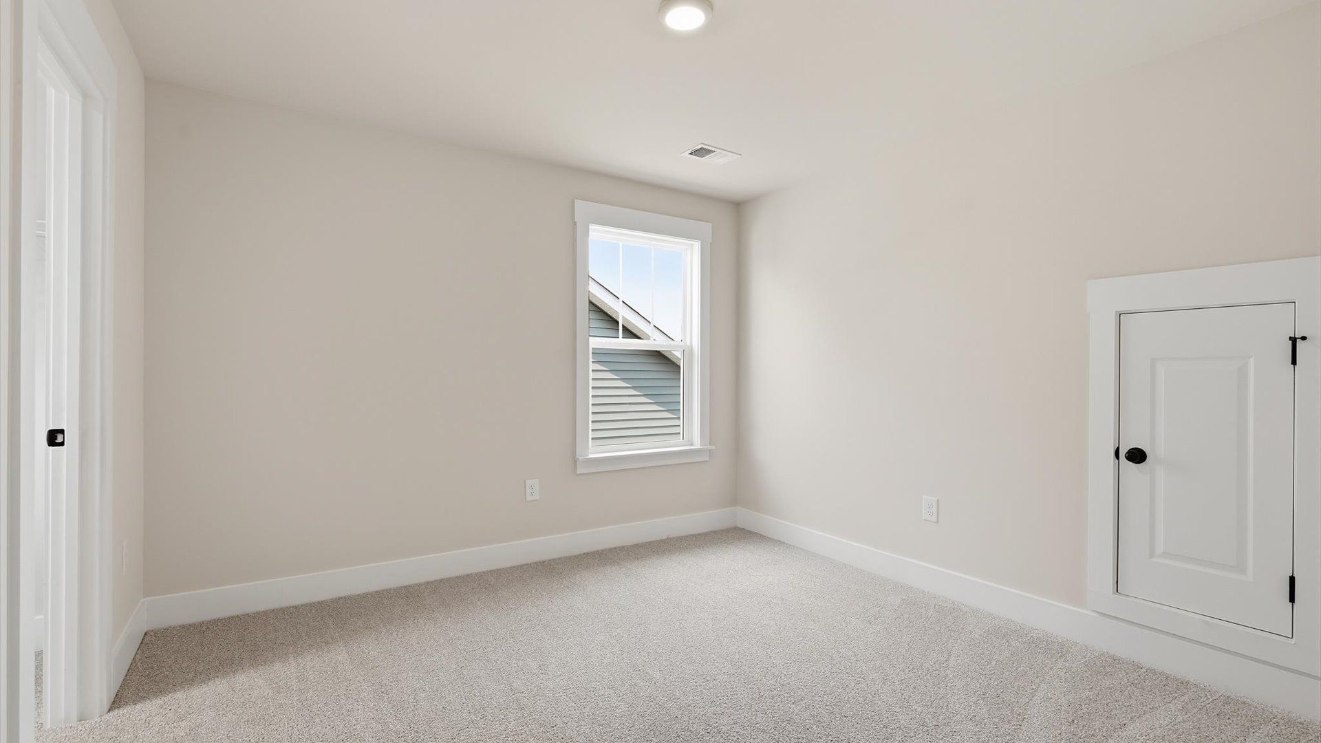 Superior comfort in this light-filled bedroom with plush carpeting and thoughtfully placed large windows