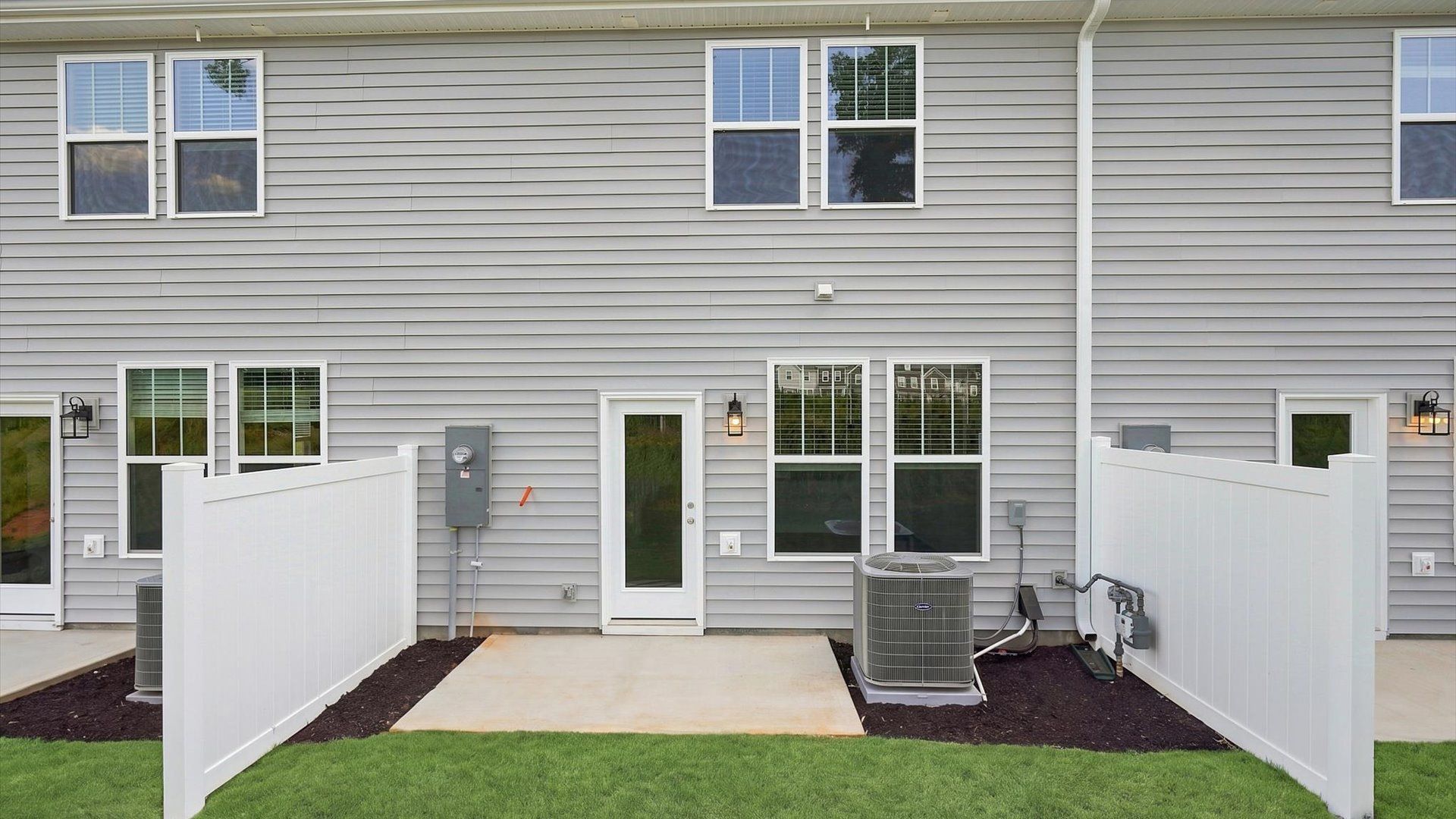 Accomplished rear exterior with a spacious patio that blends comfort and style located in Anderson, SC