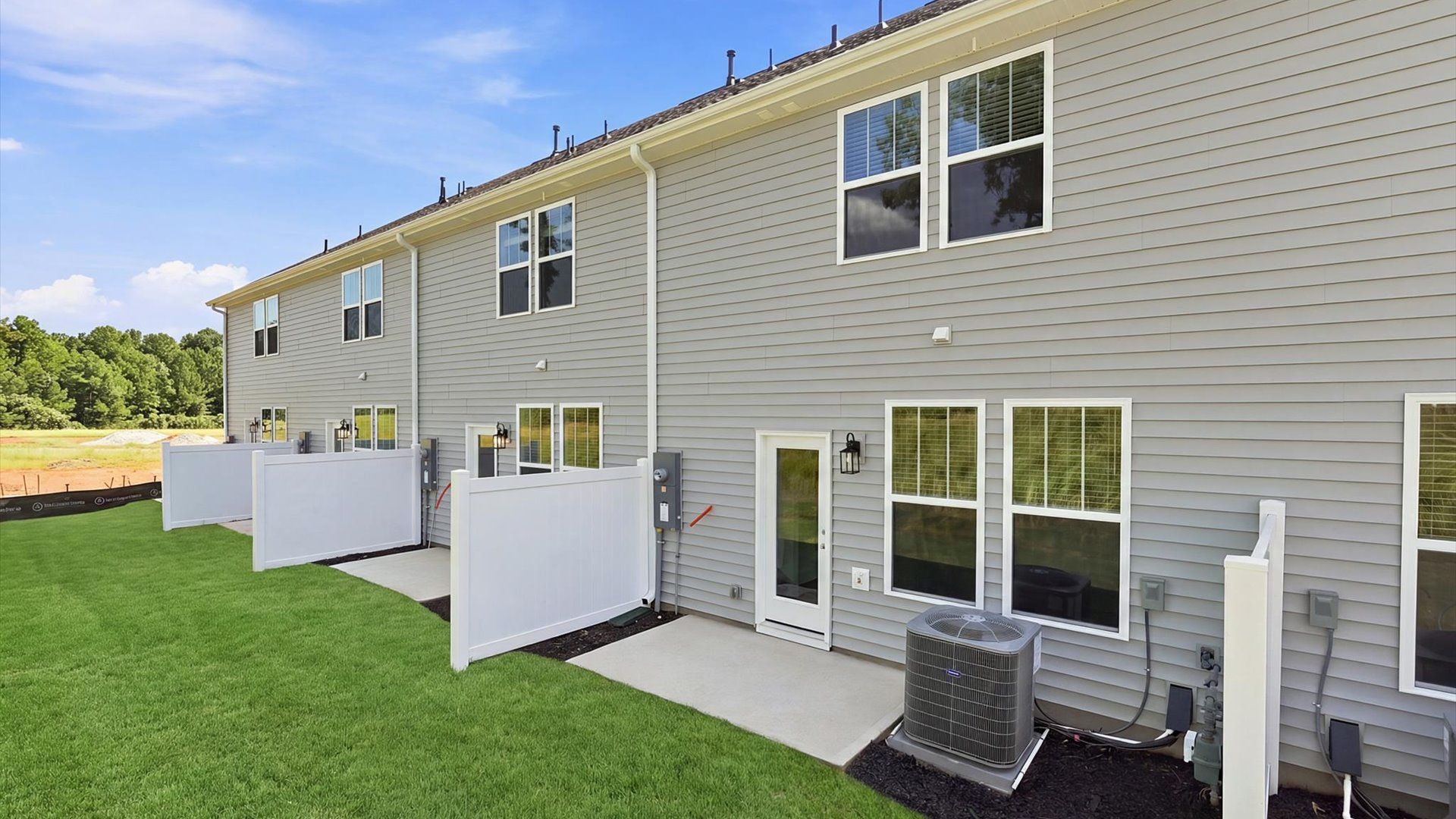 Established charm meets functional outdoor living with a spacious rear patio located at Clarke Townes