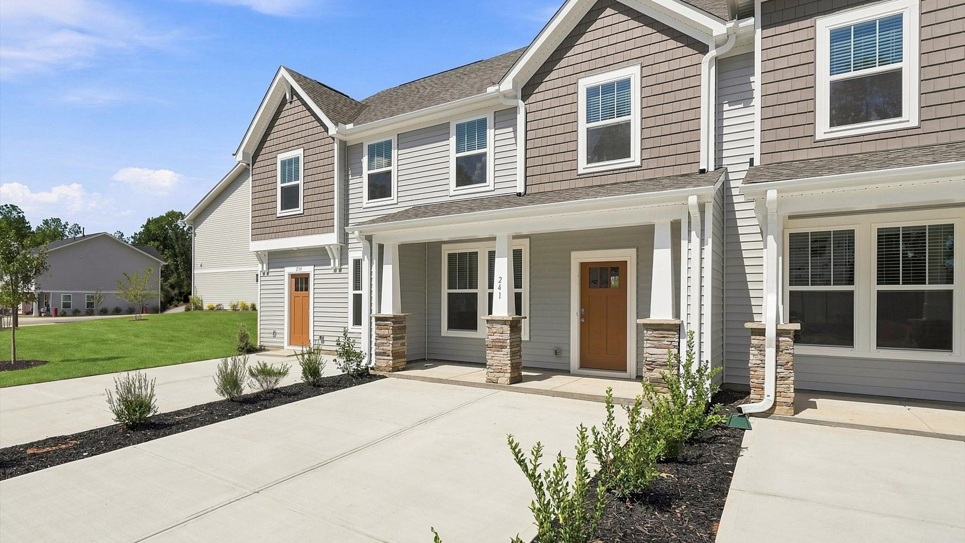 Elevated curb appeal with timeless stone accents and a welcoming covered entry located in Anderson, SC