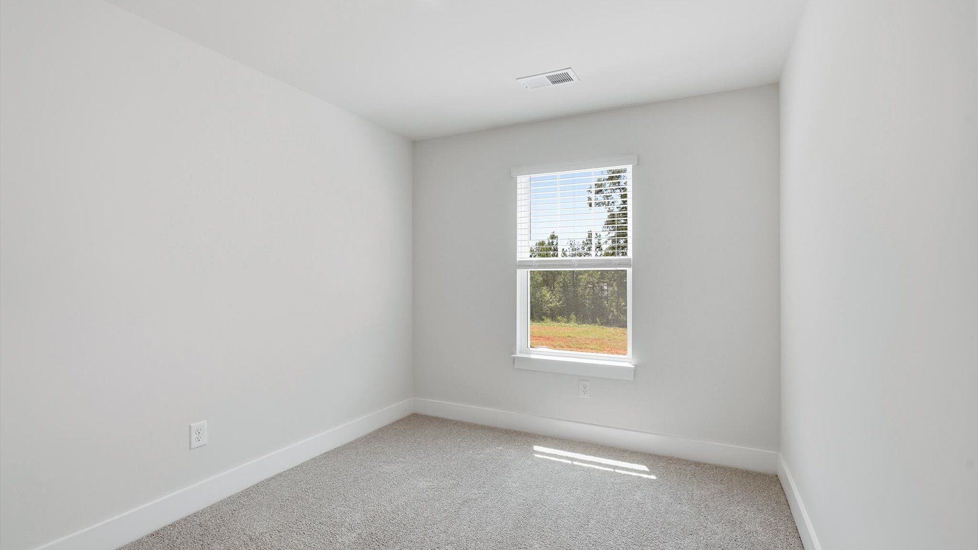 Vibrant and restful bedroom with oversized windows, refined detail, and a warm, welcoming atmosphere