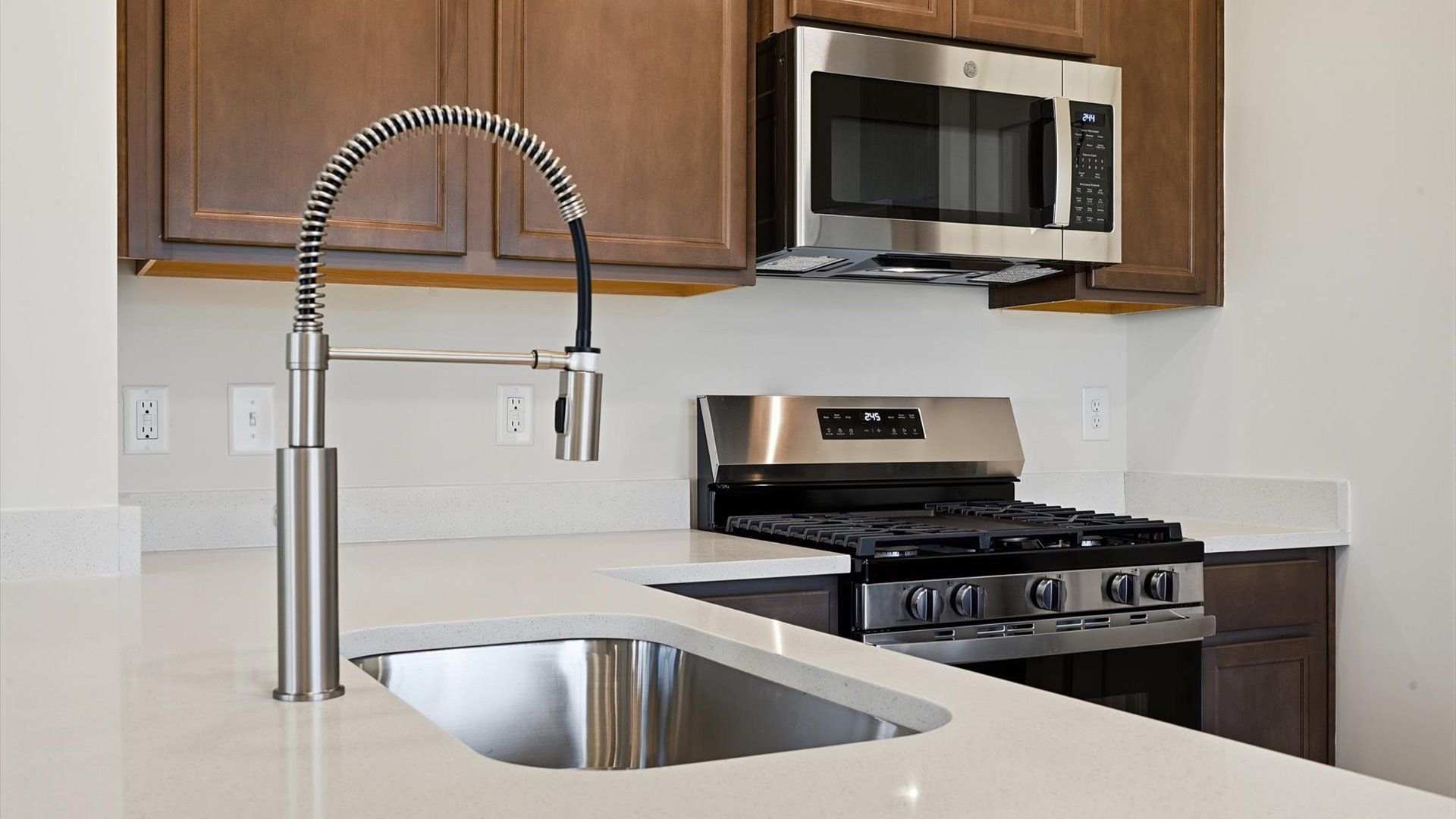Thoughtfully crafted kitchen featuring stylish hardware and polished finishes at Clarke Townes