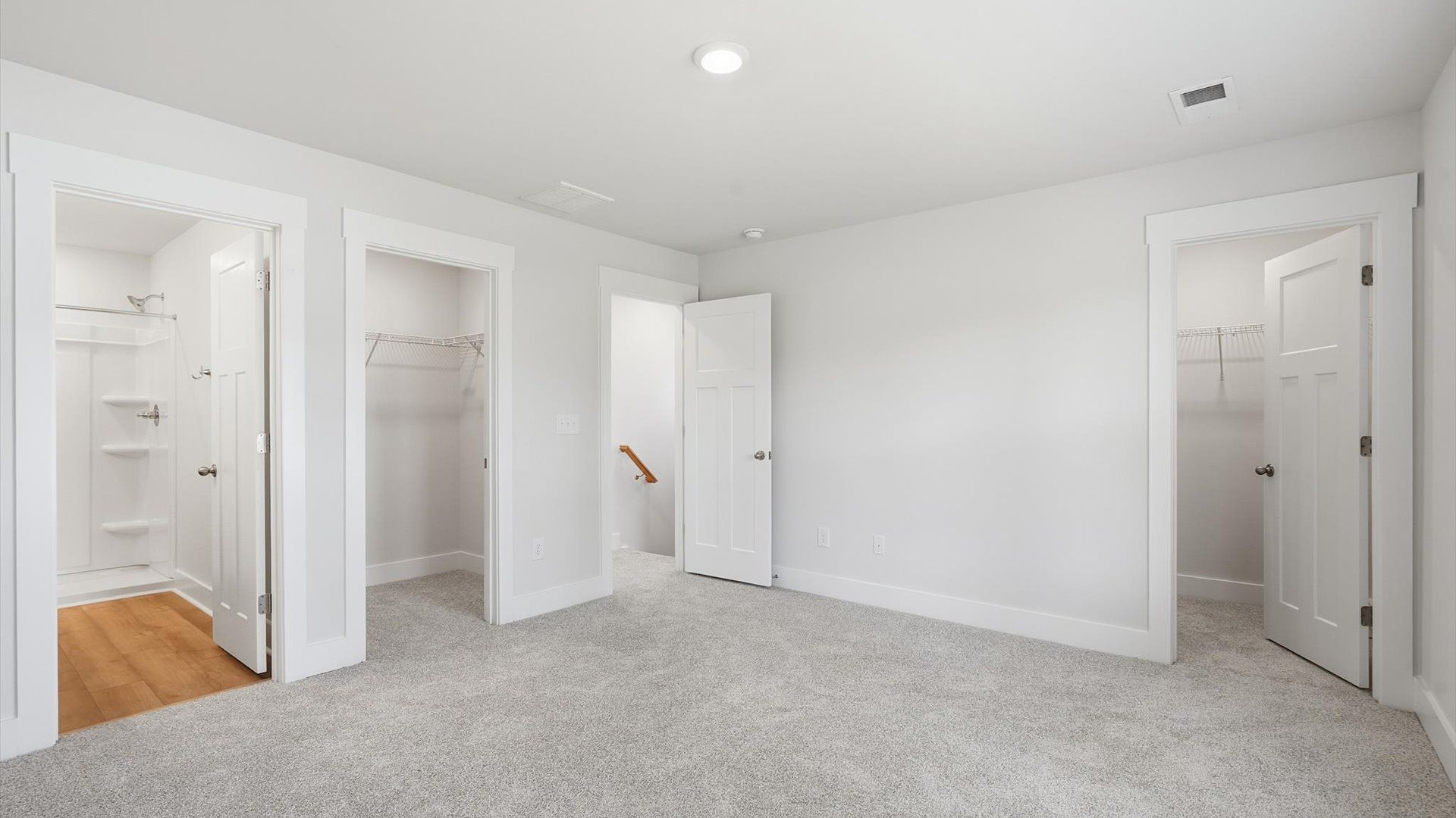 Accomplished primary retreat with eye-catching carpet flooring in a desirable Anderson community