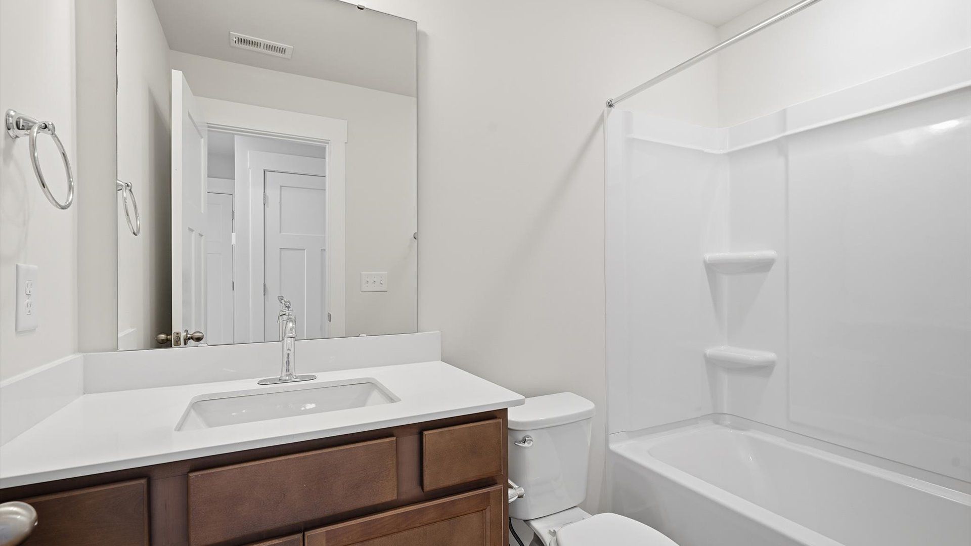 First-rate full bath featuring modern surfaces and a fresh, current color palette at Clarke Townes