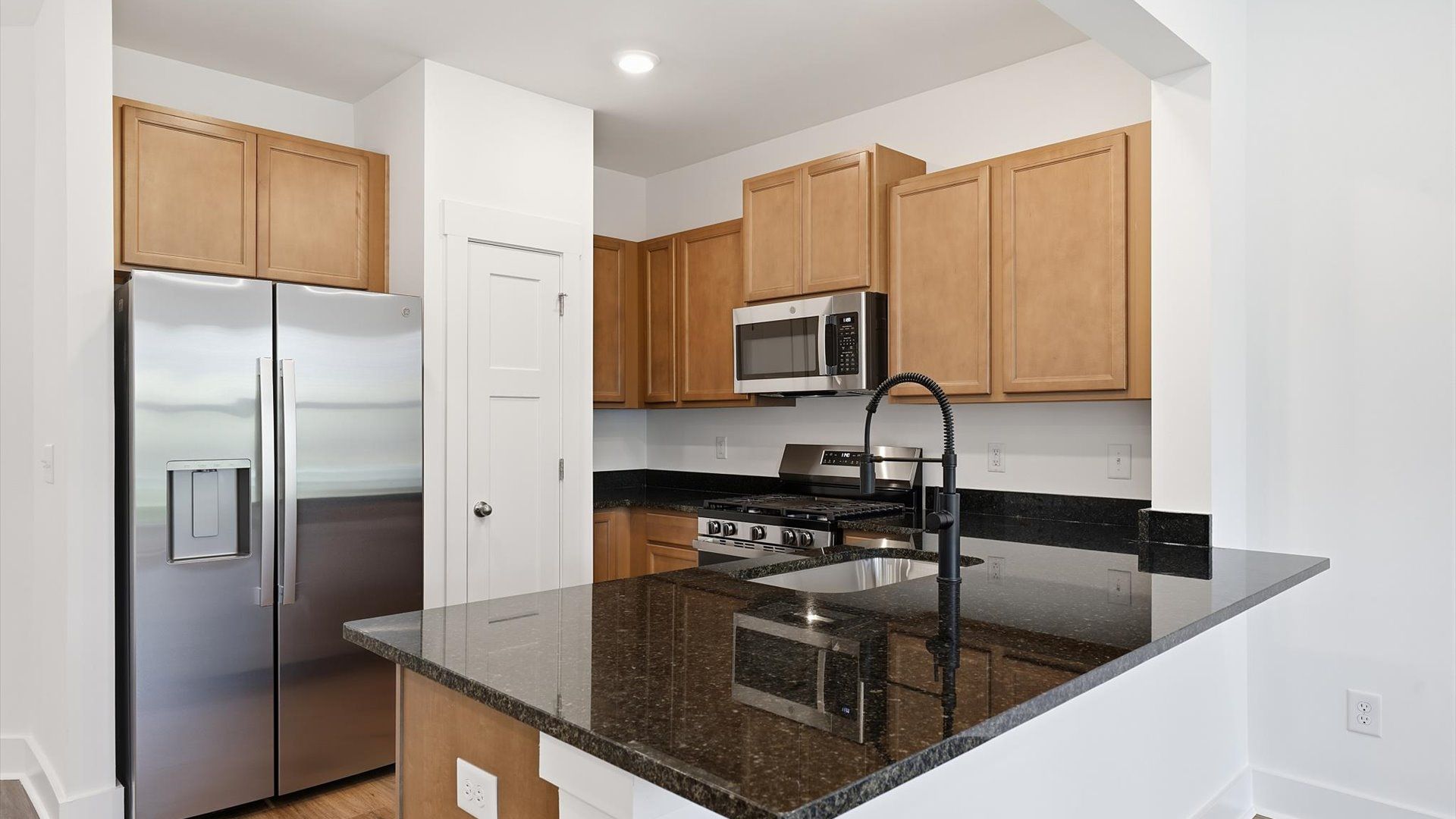 Expansive kitchen offering exceptional workspace and effortless flow to adjacent living areas by DRB Homes