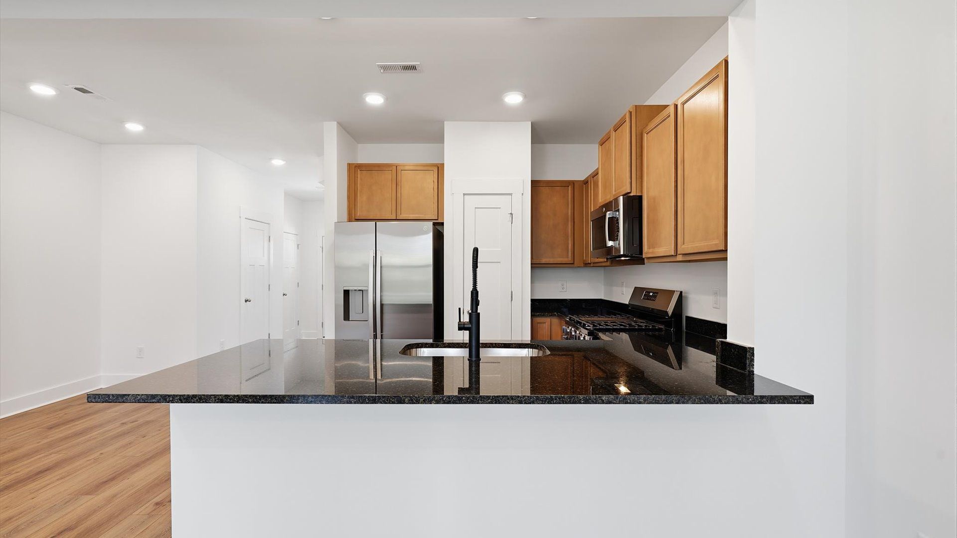 Highly skilled design choices create a clean, open kitchen with granite countertops located in Anderson, SC