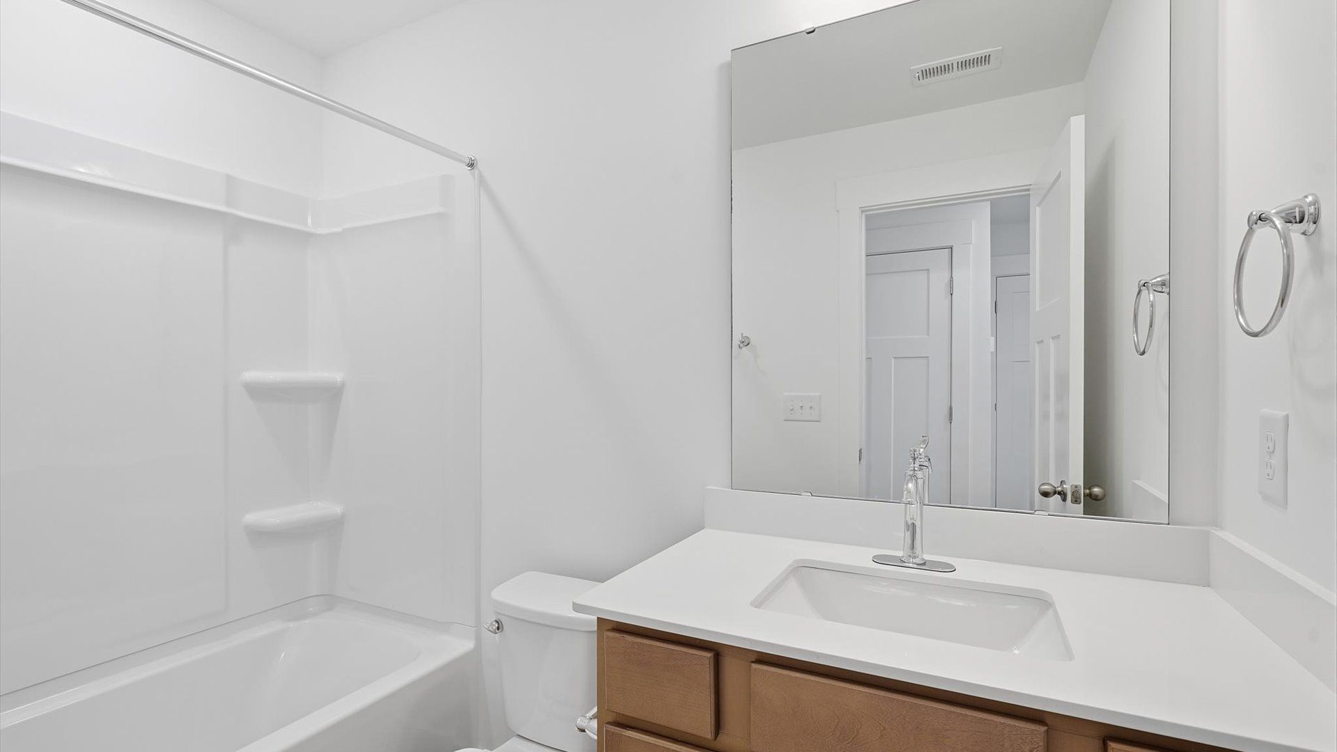 Top-notch bathroom with current fixtures, tasteful materials, and elevated charm by DRB Homes