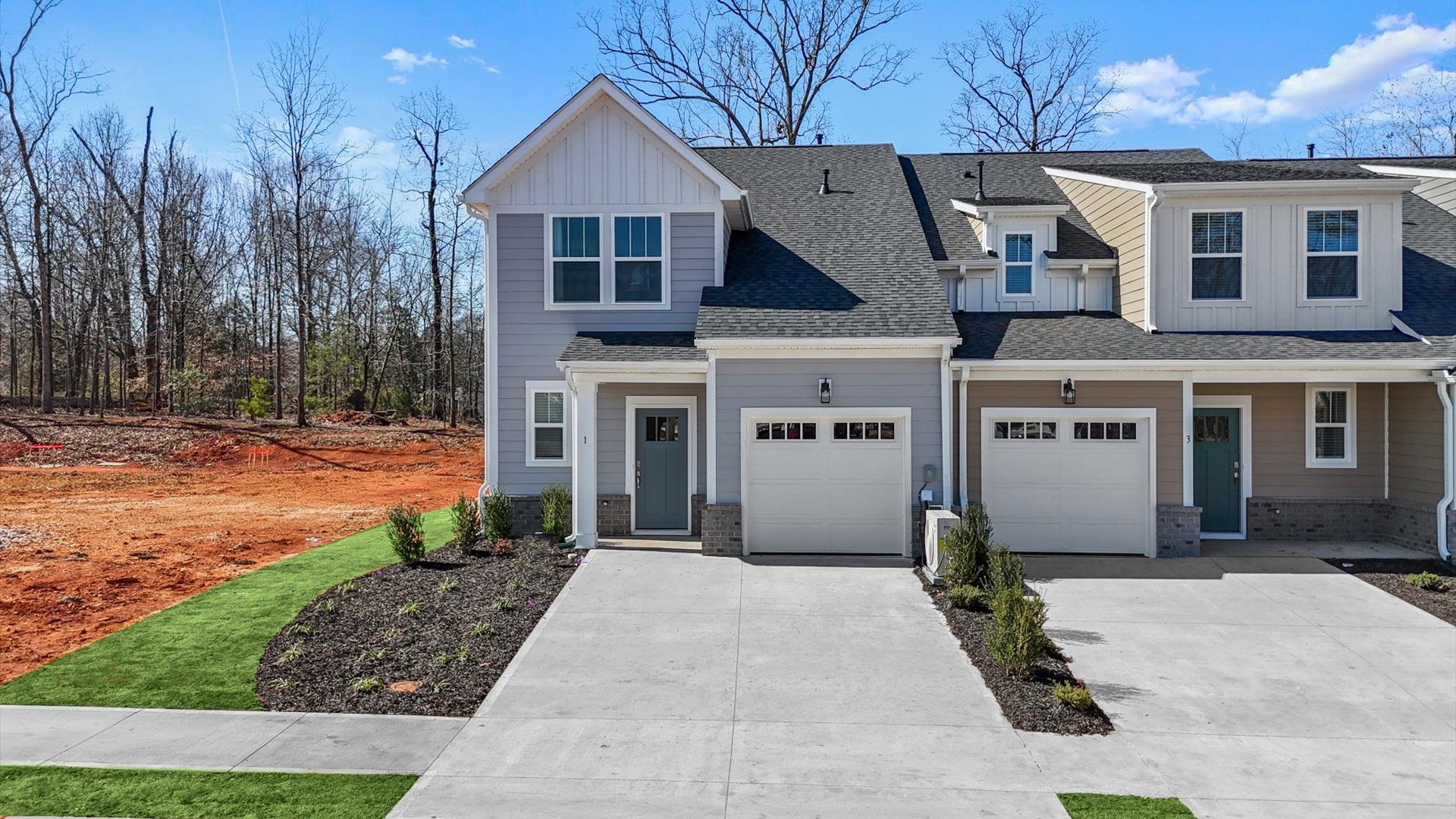 Exclusive DRB Homes Lawson exterior with balanced proportions and vibrant curb appeal at Pelham Crossing