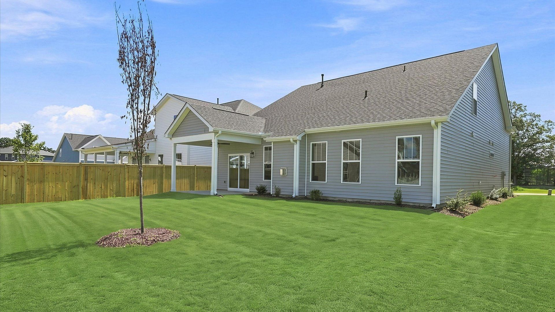 Highly functional rear covered porch adds memorable living space to this elegant home