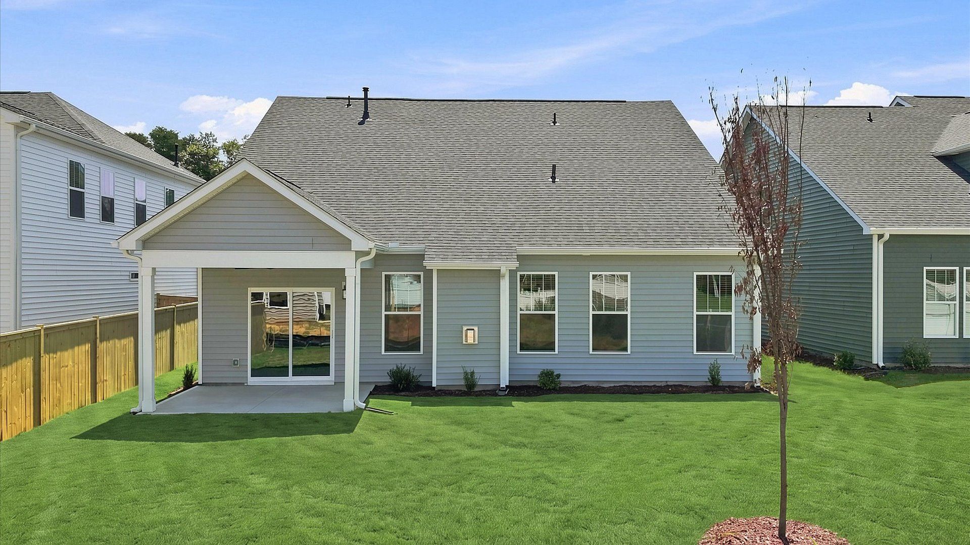 Established charm meets functional outdoor living with a spacious rear covered porch