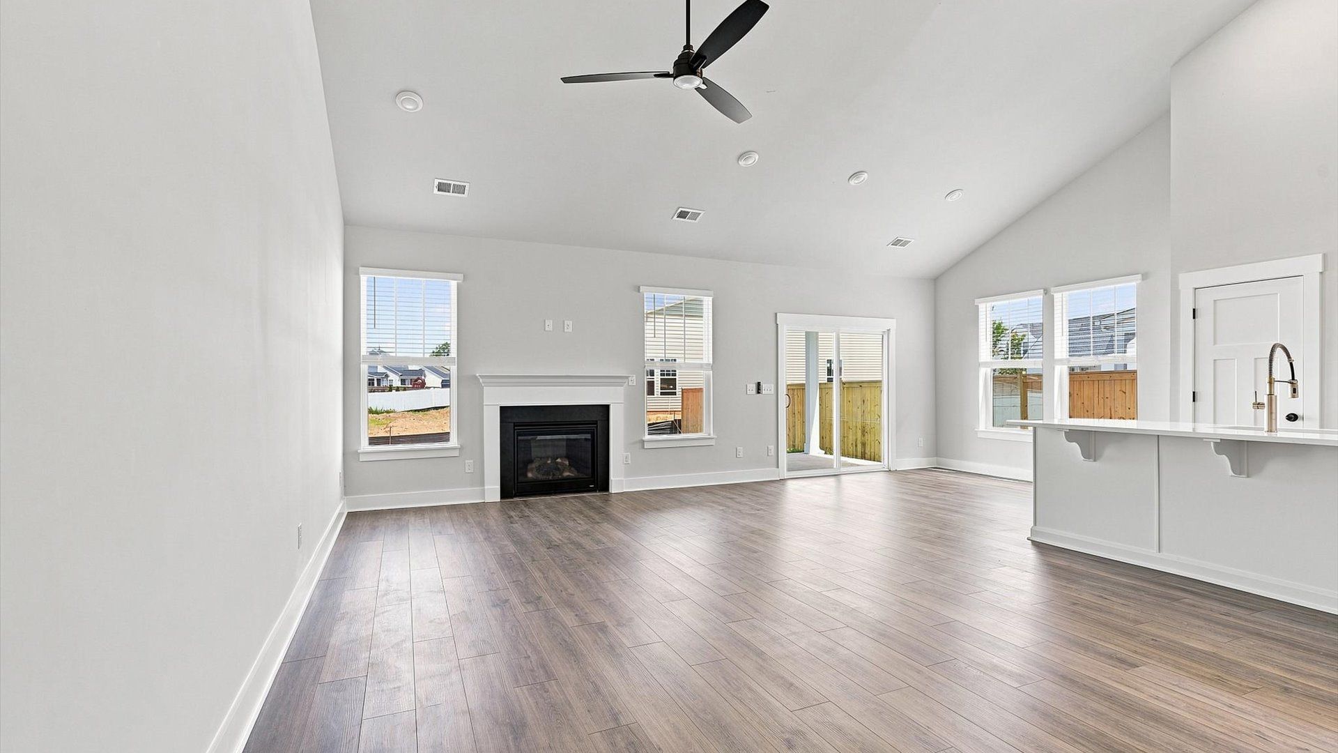 Highly skilled craftsmanship and modern elegance meet in this family room with soaring ceilings