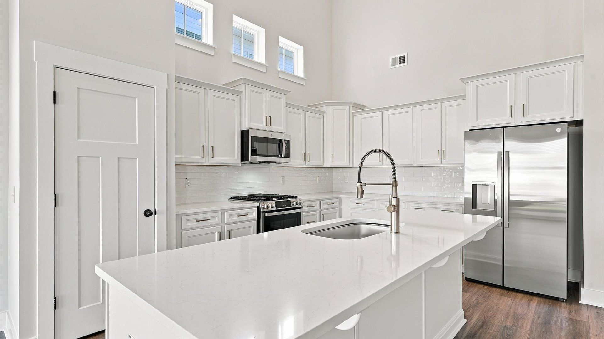 Elegant kitchen with large island in this first-class DRB Homes design