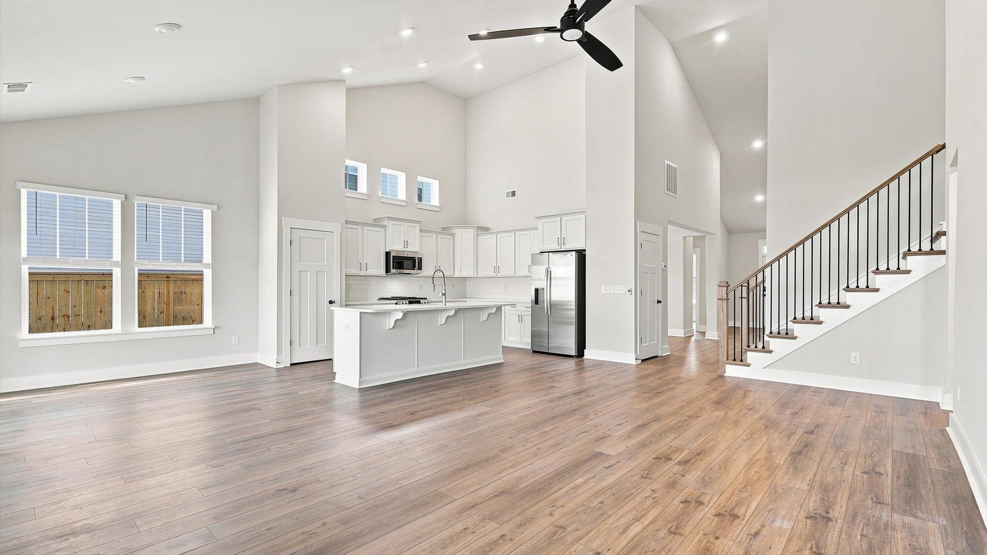 Two-story ceilings and superior scale define this elegant, light-filled family room