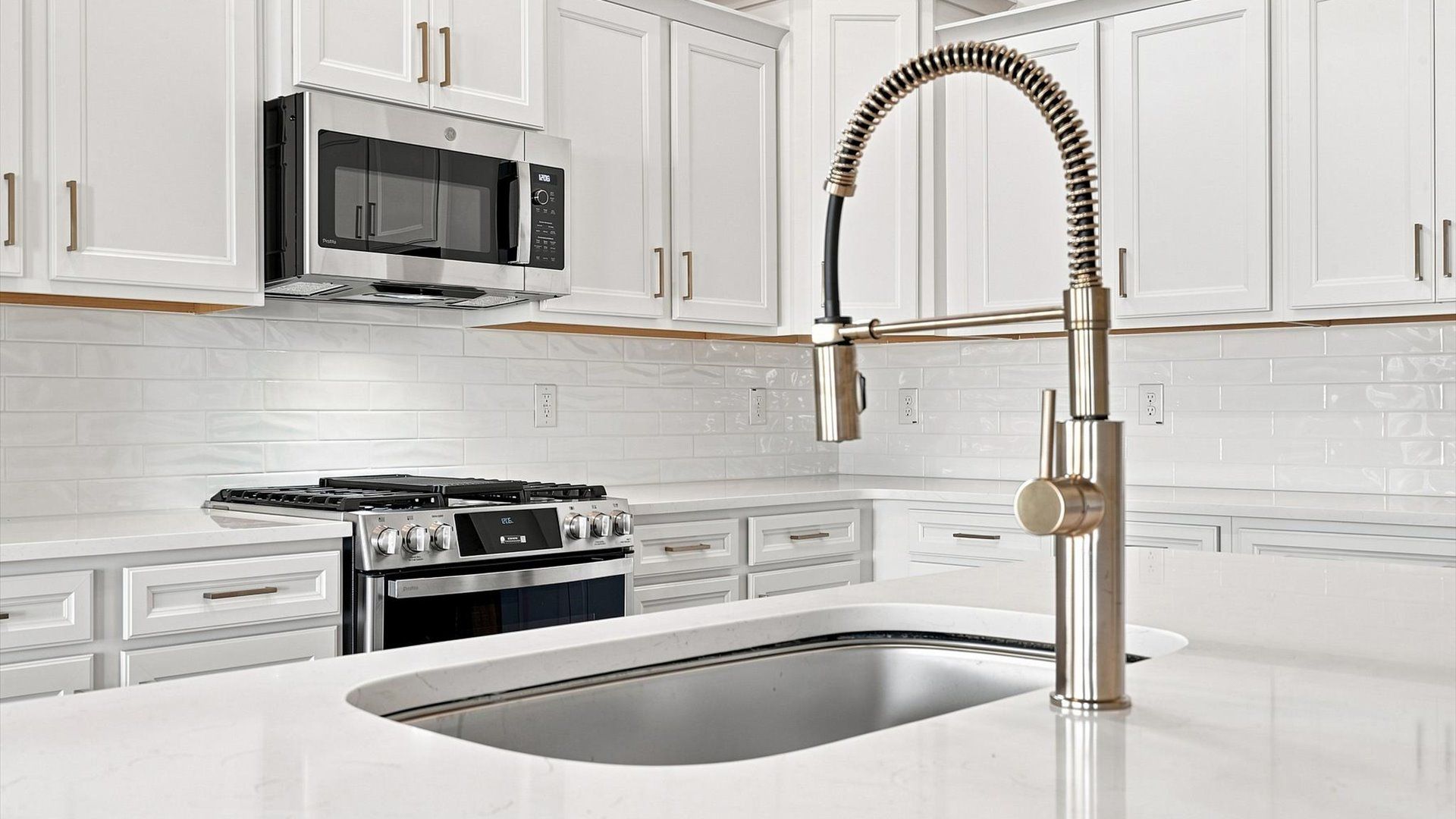 Exclusive kitchen design with large island and tasteful finishes throughout