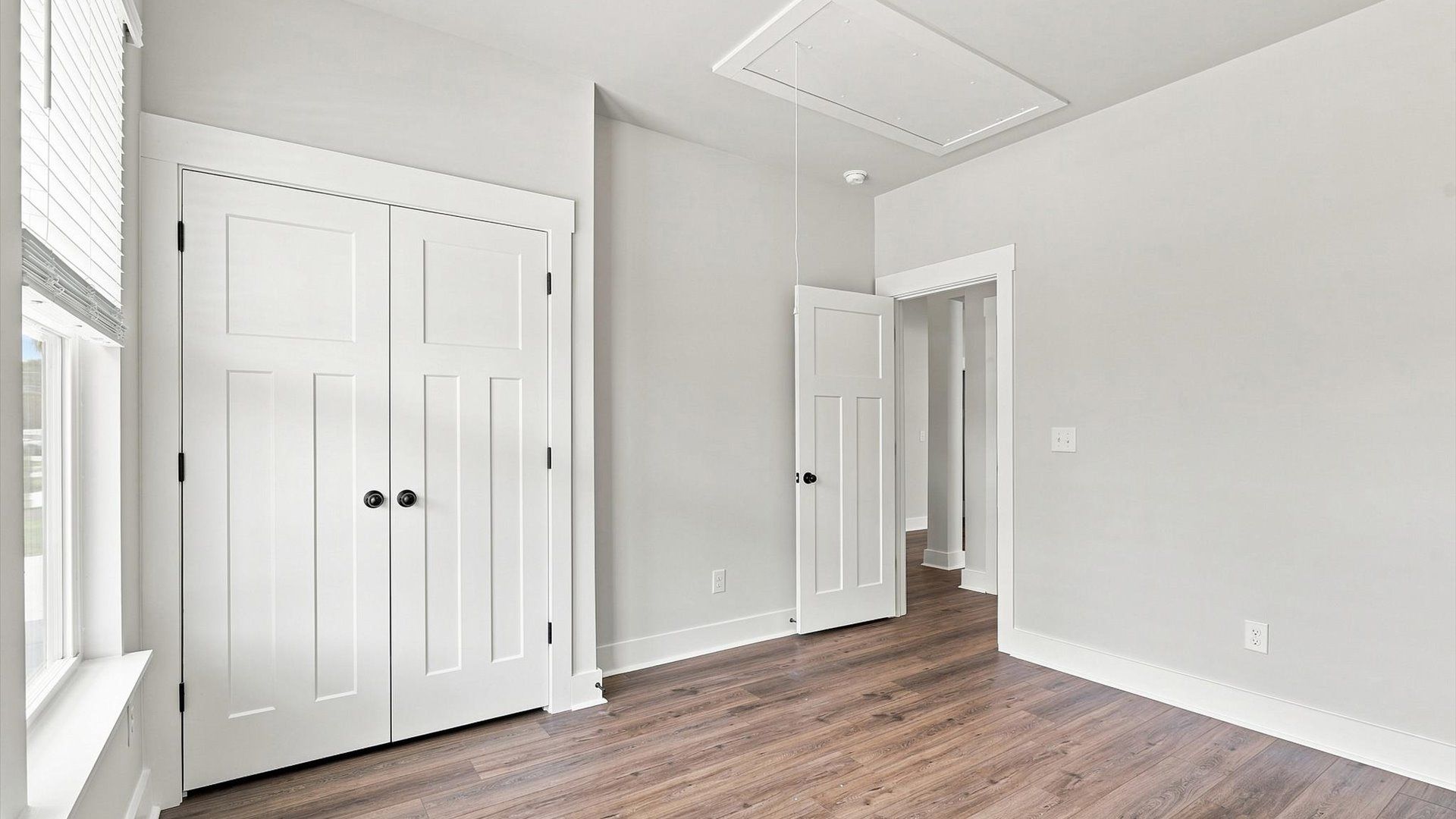 Functional secondary bedrooms with hardwood flooring and modern touches in an exceptional layout