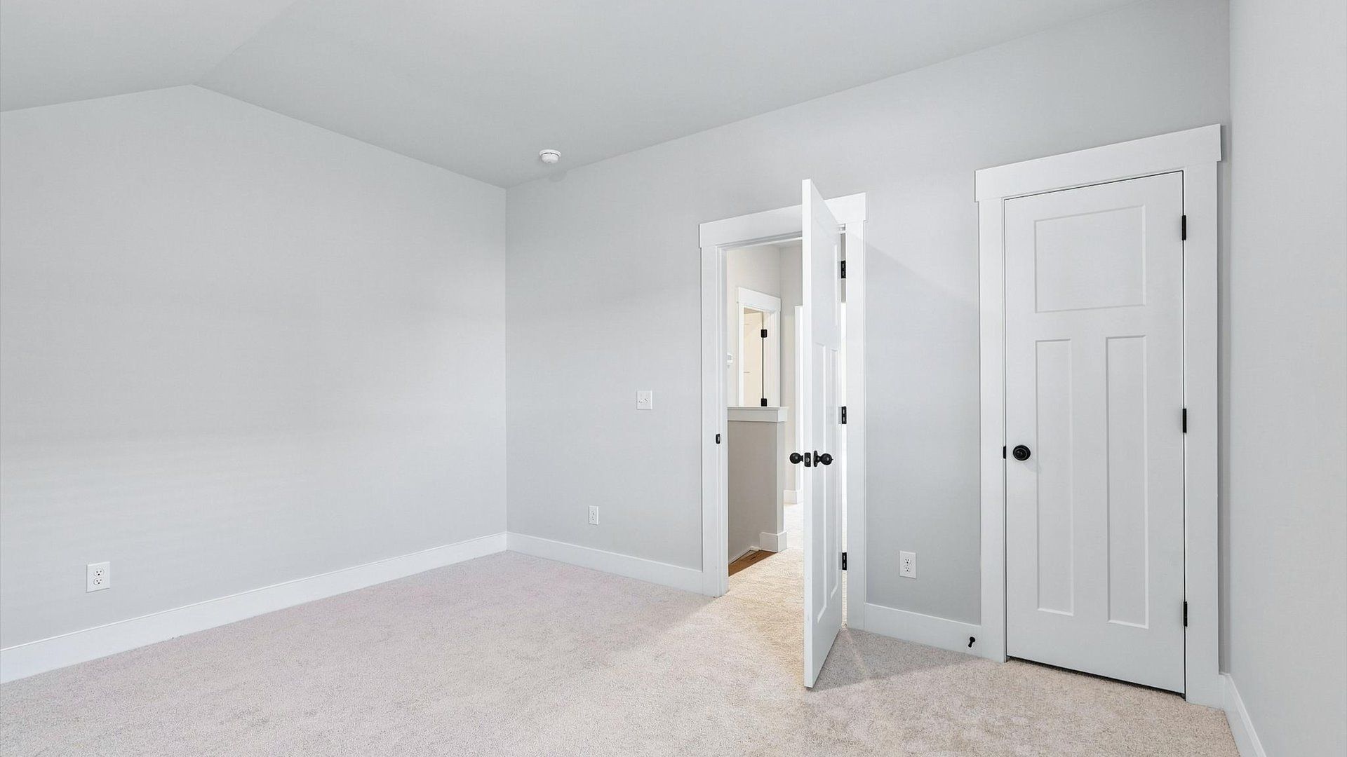 First-rate bedroom with plush carpeting and large windows that provide an open, airy feel