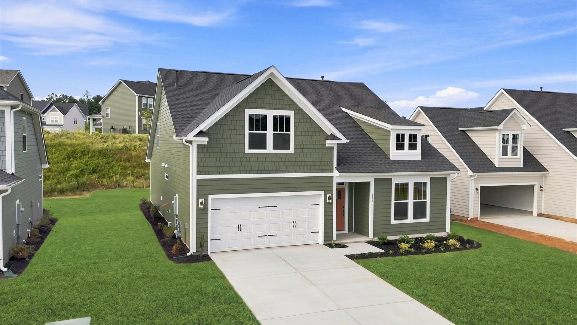 Exceptional home with tasteful exterior finishes and a thoughtfully designed façade by DRB Homes