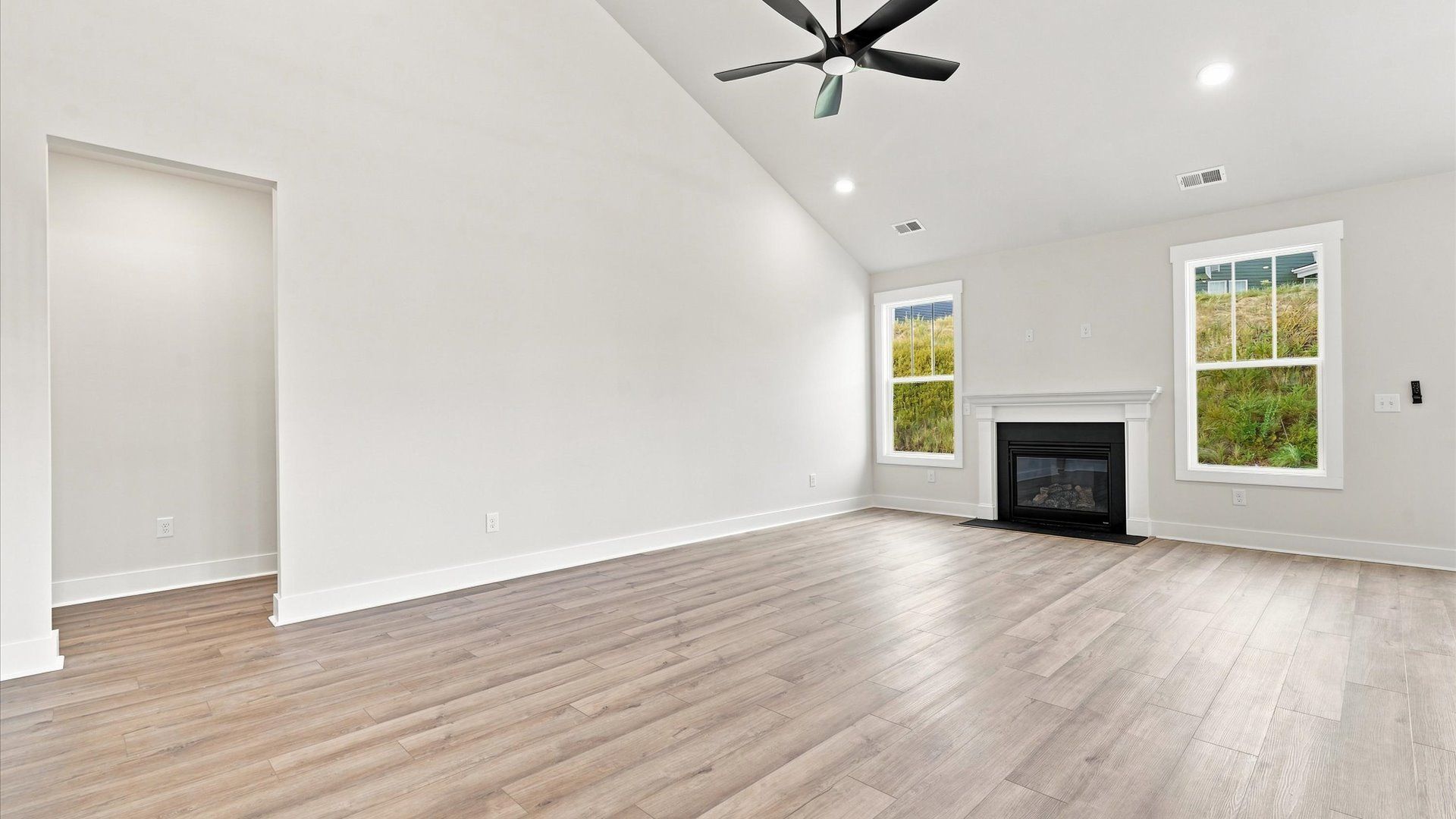 Notable two-story family room offering a grand yet inviting space for memorable everyday living by DRB Homes
