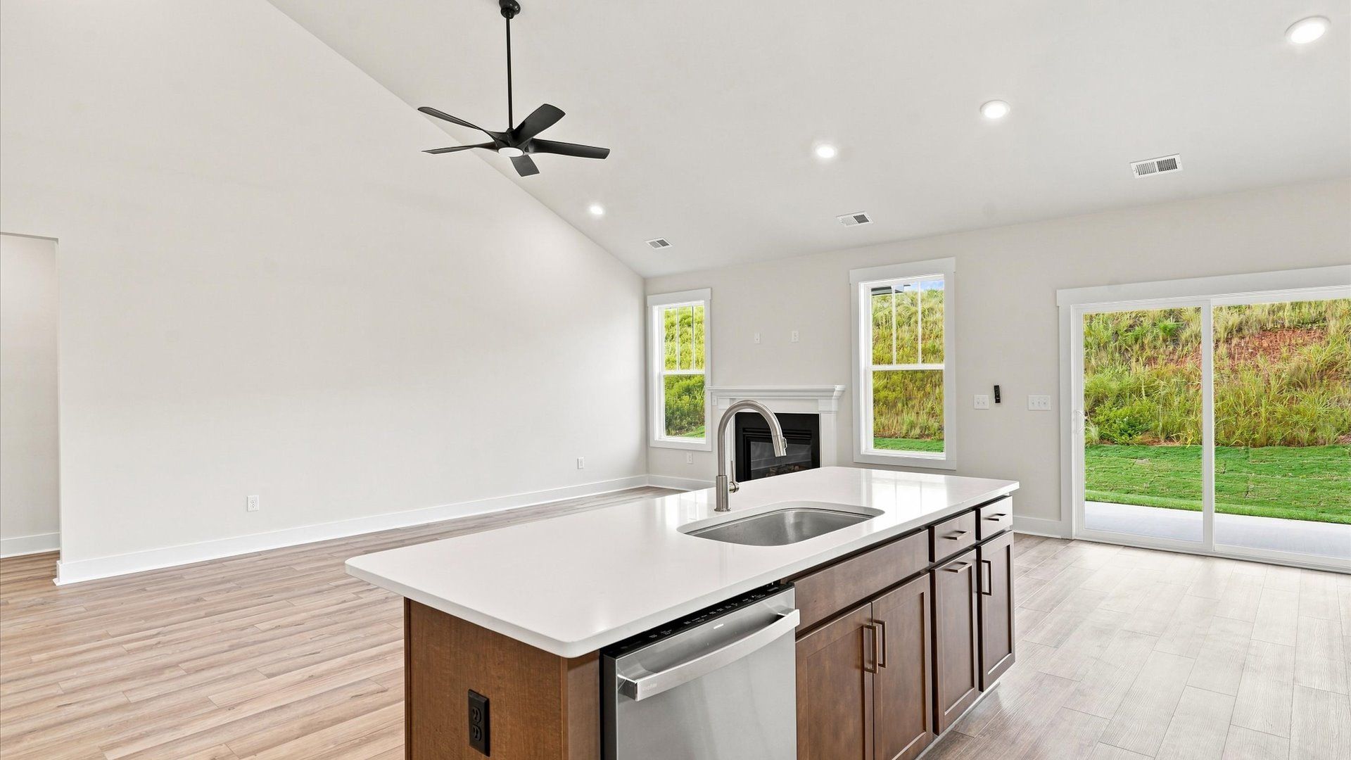 Well-designed kitchen with a center island and tasteful finishes that elevate everyday living at Wells Crossing