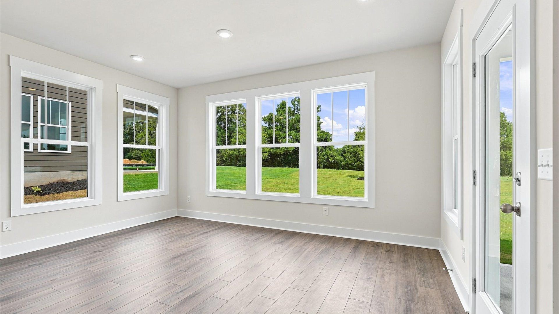 Exclusive morning room with tasteful touches, natural light, and a vibrant open-concept feel