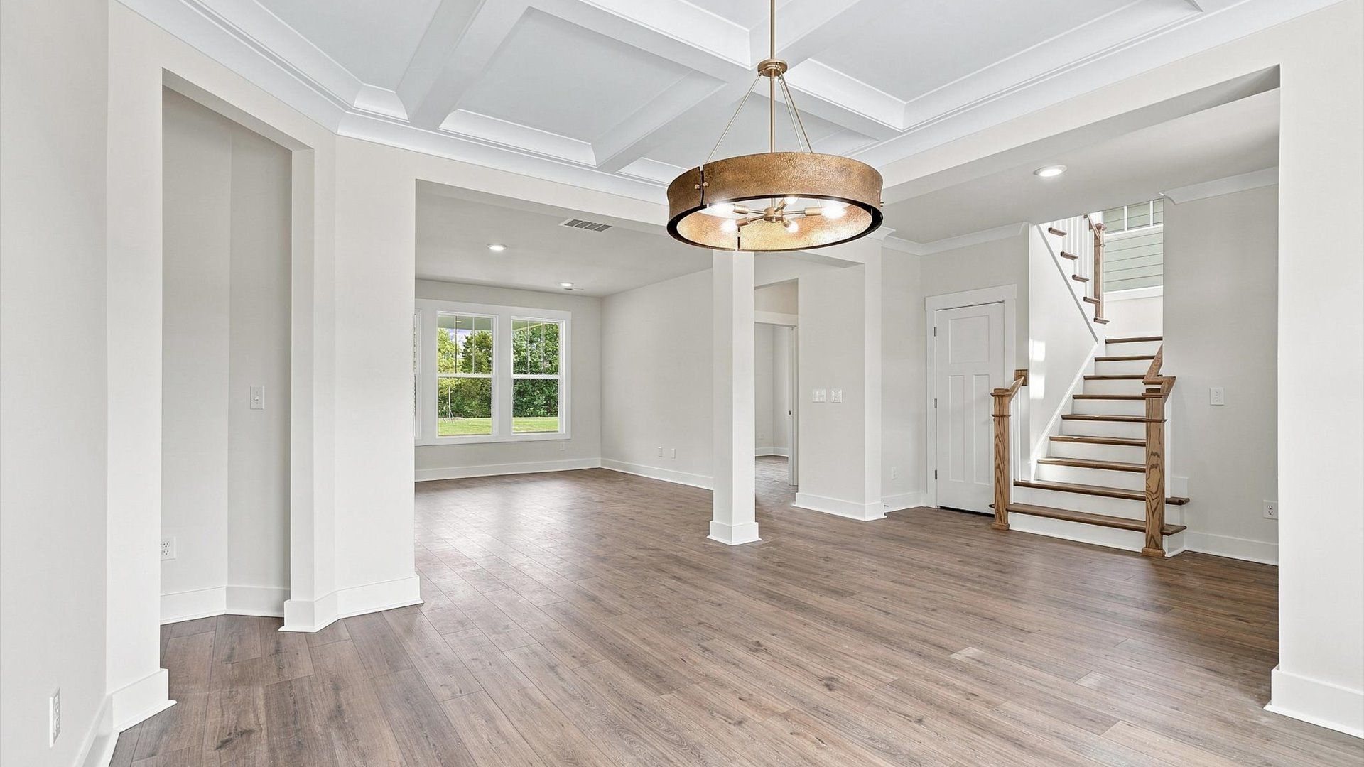 Superior craftsmanship seen in every corner—especially the coffered ceiling of this elegant dining space